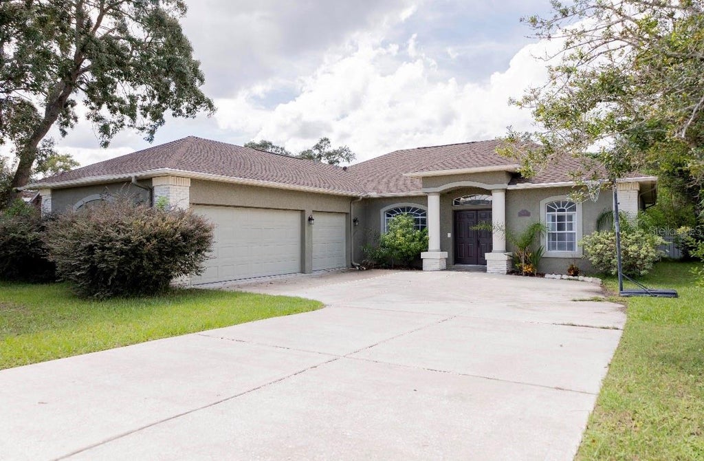 Photo of 1201 Overland Drive, Spring Hill, FL 34608 (MLS # TB8556145)