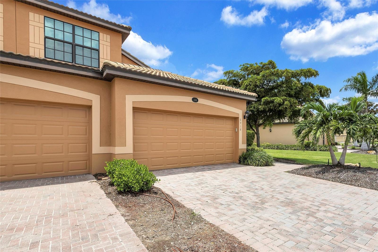 Experience true resort living with DEEDED GOLF MEMBERSHIP, in amenity rich River Strand. This first floor coach home is move-in ready and turnkey furnished. An expansive screened lanai overlooks the second green of the Sanctuary golf course. With the desirable western exposure, this will become your favorite place for tranquil mornings, entertaining and watching brilliant sunsets. Step outside for a swim anytime- one of six community pools is just a few feet from your front door. Inside, just under 1800 square feet of open living space makes entertaining easy and a split bedroom plan gives privacy for you and your guests. The primary suite features new flooring, dual walk-in closets and ensuite bath with double vanity, soaking tub, and shower. New HVAC system in 2023. River Strand residents enjoy 9 Har-Tru tennis courts, pickleball courts, two resort pools and 6 satellite pools, fitness centers, food and beverage options, 24 hour guard gate, and a full social calendar. An $8 million enhancement to the clubhouse and tiki bar is due to be completed by January 2026. This is vacation living year round.