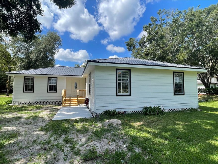 Welcome to this move-in ready 4-bedroom, 2-bath home with an additional bonus or office room, offering 1,956 square feet of heated and cooled living space on a beautiful 2+ acre lot. Conveniently located near shopping plazas, grocery stores, I-75, and zoned for top-rated schools—Chiles Elementary, Kanapaha Middle, and Buchholz High—this rental is a rare find with its excellent location, spacious yard, open view, and stress-free living with lawn service included!

Enjoy brand-new luxury vinyl flooring throughout all bedrooms and living areas—no carpet anywhere! The updated kitchen boasts granite countertops and stainless steel appliances overlooking the spacious backyard. The open floor plan and split-bedroom layout provide both comfort and privacy, while the versatile bonus room offers flexibility for a home office, playroom, or hobby space.

The primary suite features a large walk-in closet and an updated en-suite bathroom with a stylish walk-in shower. Three guest bedrooms share a full bathroom and offer ample storage space. Additional highlights include double-pane windows, abundant natural light, and a dedicated laundry room. Step outside to the newly built oversized deck overlooking the expansive, lush backyard—perfect for relaxing or entertaining family and friends.

Additional highlights include well and septic systems, so tenants only pay for electricity—a great bonus! No HOA! Pets are welcome with a separate pet fee. Schedule your VIP tour now!