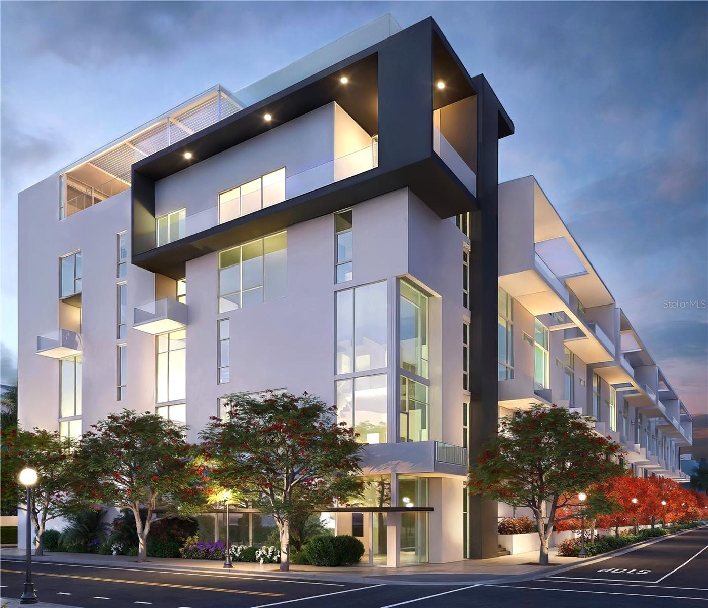 Under Construction. This elegantly expansive home from The Gallery’s Iconic Open Staircase Collection, just three blocks from the bay above floodplain showcases unparalleled visual drama with a sweeping open staircase and soaring 24-foot full-height windows that fill the interior with natural light, seamlessly blending the indoors with the outdoors.
The designer-integrated kitchen is a masterpiece, boasting built-in Italian Fulgor Milano stainless steel appliances, imported Italian flat-panel cabinetry, and a stunning grand island with quartz countertops. The well-appointed primary suite spans the width of the residence, offering a generous walk-in closet and a spa-inspired bath complete with a luxurious free-standing soaking tub, a glass-enclosed walk-in shower, and a floating dual-sink vanity.
Exceptional amenities include a spacious west-facing rooftop pool terrace for soaking up the sun, a stylish social lounge, a summer kitchen, and a state-of-the-art two-room Fitness Center and Yoga Studio outfitted with the latest cardio and strength-training equipment. Under construction with limited availability, we invite you to schedule a private site and showroom tour to receive an in-depth look into what we have planned for the residents. Our showroom is located at 625 S Orange Sarasota, FL 34236 (retail space at Orange Club).