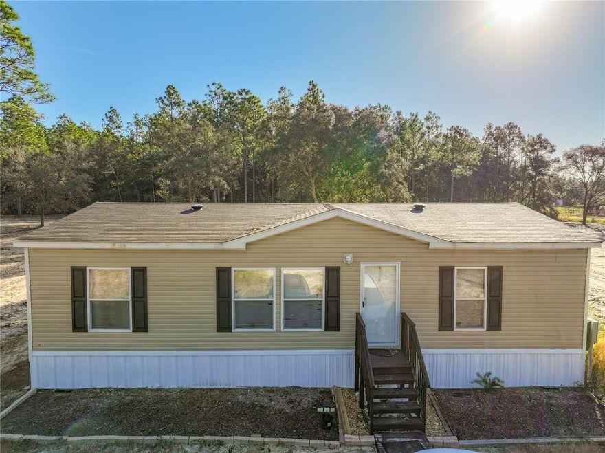 Discover peaceful country living just minutes from the conveniences of the city at this beautiful like new manufactured home on 2.50 acres in Archer Florida. Built in 2023, this modern move-in ready residence features approximately 1,144 sq ft of comfortable, open-plan living space, three bedrooms, two full baths — perfectly tailored for anyone seeking room to roam.
Outside you’ll find plenty of room for gardening, recreation or even a future workshop or barn — ideal for hobbyists, animals or simply enjoying the space.
Located in the quiet, friendly community of University Estates. You’ll enjoy quick access to nearby schools and major roadways while still getting the privacy and serenity of a countryside setting. 

Built in 2023 – modern construction and systems. 
1,144 sq ft of living space. 
Two full baths – great for guests or shared living. 
Generous 2.50-acre lot gives room to breathe and grow. 
Manufactured home style, thoughtfully sited and maintained. 

This one-of-a-kind home offers a rare combination of new-home comforts, rural acreage and proximity to everyday amenities — all without the urban hustle. Don’t miss the opportunity to make this Archer retreat your own.