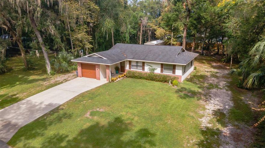 If you love Scalloping, Fishing, Boating, Hiking, Kayaking or the Gulf of Mexico Woodland Estates should be your next purchase! Moments from the Nature Coast of Florida, Crystal River Preserve State Park and the Withlacoochee State Trail Stylish and set in a fantastic community, this beautifully maintained Crystal River home on 0.44 acres is ready for you to move in, unpack, and relax! Elevated to avoid possible flooding, a long driveway bordered by manicured landscaping leads to this abode’s  Discover an open-concept interior clad in crisp white tones, vaulted, beamed ceilings and chic wood tile flooring. The kitchen Skylight illuminates the recently reimagined kitchen, equipped with a spacious undermount farm sink, refrigerator, range with hood, gorgeous soft-closing shaker-style cabinetry and quartz countertops.
Retire to the comfortable proportions of the carpeted private retreats, including the primary suite with its walk-in closet and exquisitely updated ensuite. Unwind and entertain year-round on the enclosed patio, surrounded by vinyl windows framing delightful outdoor views. It opens to a secluded, tree-dotted backyard ideal for recreational activities. Perks include city sewer, city water, an attached 1-car garage and a neighborhood private boat ramp with the "OPTIONAL" HOA annual membership($40 per year for Associate Membership or $140 per year Boat Ramp Club Membership). Enjoy evening golf cart rides, local shopping and dining, while adventure enthusiasts will appreciate the close proximity to Crystal River Watersports. 
Live here year round, part time or simply as an investment. Minimum rental period is 3 months. Make sure you take time to see the floor plan with room sizes, the interactive floor plan and all the pictures of the area amenities. Recent updates include: New Roof(2017) * Kitchen remodel (2021) * Master Bathroom remodel (2021) Guest Bathroom remodel (2021) New tile flooring (2021) * Survey & Elevation Certificate available. Come for a tour before it’s gone for good!