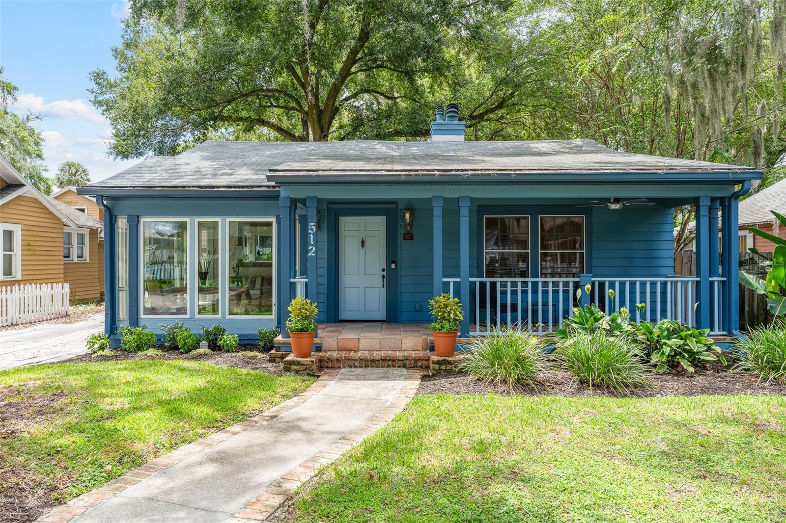 Charming 1936 historical home plus income apartment-Lake Eola Heights. Step into rare piece of Orlando history with this beautifully restored 1936 home, ideally located on a picturesque, tree-lined in the coveted Lake Eola Heights District. Just a short stroll from Lake Eola, downtown's vibrant restaurants and bars, and only doors away from the beloved Eola General, the property offers the perfect blend of charm, character, and convenience. The main residence feature three bedrooms, two updated bathrooms, and a two-car garage, along with sunlit bonus room perfect for relaxing and watching the world go by. Thoughtfully modernized while preserving it's original character, the home boasts a brand new kitchen with recent appliances, elegant new bathrooms, fresh interior paint, luxury vinyl and ceramic tile flooring, and updated windows in the bonus room. The welcoming family room centers around a classic wood burning fireplace, with a dining room that opens at both ends to create a seamless flow into the kitchen and living space. Enjoy sitting on the front porch or the rear wooden decking. As an exceptional bonus, a detached 782 sq ft one bedroom, one bathroom apartment provides a unique opportunity for additional income, a private guest suite or a multi generational living space. Fully renovated with it's own brand new kitchen, bathroom and modern flooring. Enjoy a moment or too sitting on your own balcony, this apartment offers flexibility and value for it's next owner. Whether you are looking for a forever home or a smart investment in one of Orlando's sought after neighborhoods this property delivers timeless charm modern upgrades and an unbeatable location. Don't miss this rare chance to own a piece of Lake Eola Heights history - Schedule your private showing today.