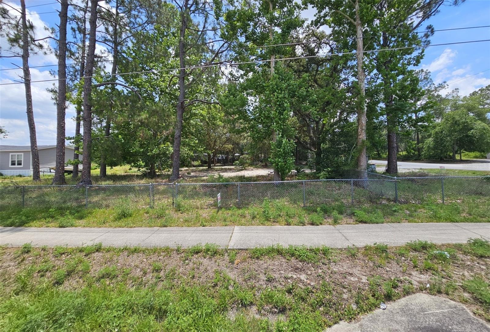 Just under 1 acre lakefront. No HOA. Electricity, Well and Septic on property. $8,223 in impact fee credit from mobile home being removed. Agricultural zoning, so bring your horse, chickens, etc. Great location between Eustis and DeLand. Short drive to the beach in New Smyrna. St Johns River access at Ed Stone Park and Boat Ramp about 10 minutes away. Winn-Dixie/Aldi about 15 minutes away toward DeLand. Short drive to Orlando, Mt. Dora, Eustis, DeLand, Sanford, etc. Sanford Orlando International Airport is a short drive away. Orlando International is reasonable distance as well.