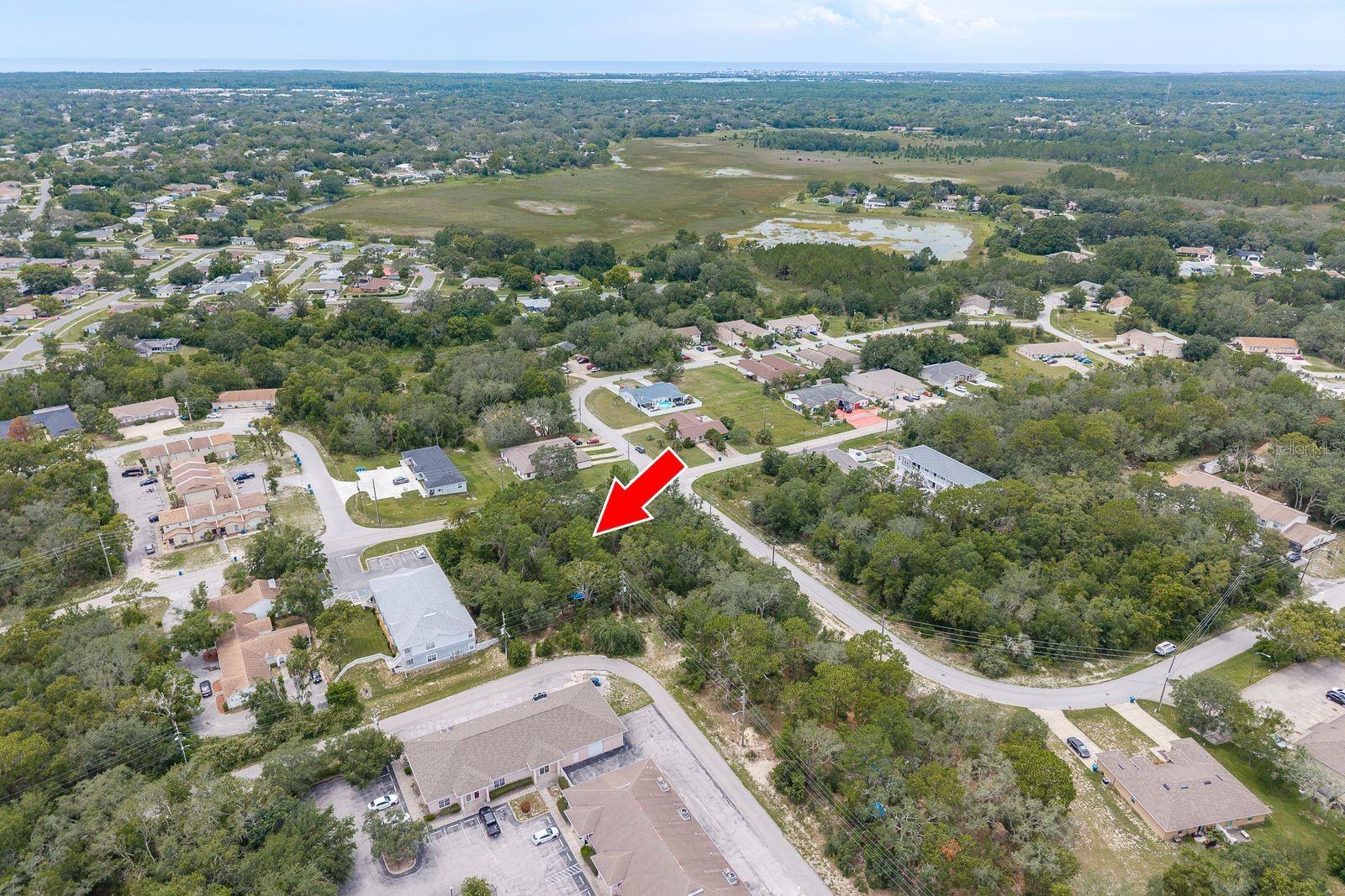 Prime Multi-Family Development Opportunity! This spacious lot in Spring Hill is zoned for up to 10 units, making it an excellent investment for developers or savvy investors. Surrounded by established multi-family communities and conveniently located near shopping, dining, medical facilities, and top attractions like Hernando Beach and Weeki Wachee Springs State Park, this site offers both lifestyle appeal and income potential. With quick access to US-19, commuting to Tampa, Clearwater, and St. Petersburg is a breeze—making this an ideal location for tenants seeking both convenience and comfort. Don’t miss this rare opportunity to build your next income-producing property in a fast-growing area with strong rental demand!