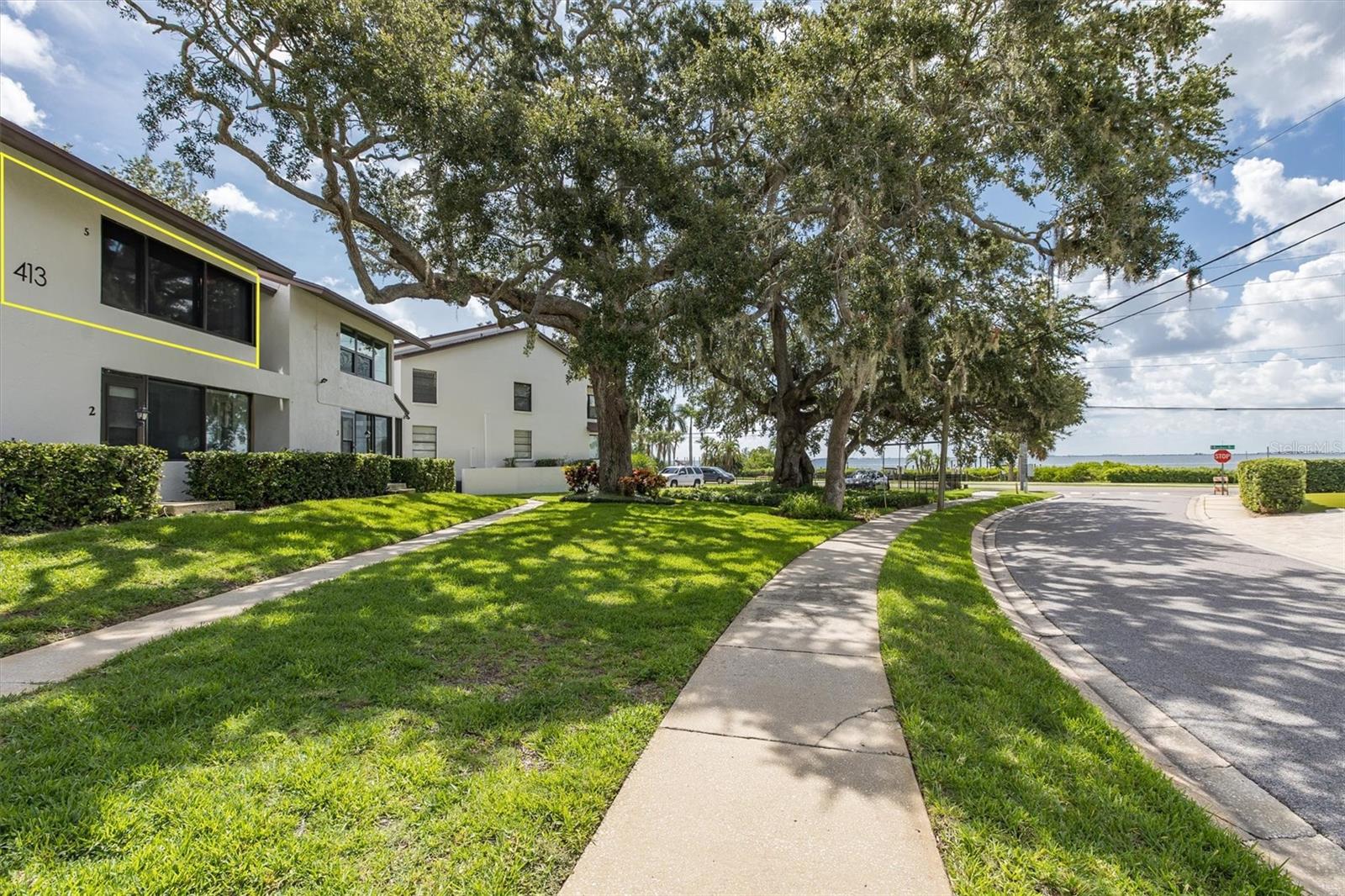 Experience the perfect combination of modern upgrades, natural beauty, and an ideal location at Lovers Oak Condominium. Live the carefree lifestyle blocks from shopping, dining and community celebrations. Easy for seasonal or full time residents! This impeccably maintained top-floor condo features updated kitchen and baths with contemporary finishes, and a cozy sunroom with breathtaking water views of Tampa Bay, creating the perfect space to relax and unwind. The community grounds boast approximately 144 feet of waterfront along Tampa Bay, with newly renovated dockage and a soon-to-be restored kayak rack to enhance coastal adventures. Each unit has its own deeded slip; this unit has one of the best in the deepest water. Enjoy the sunrise or mingle with neighbors at sunset on the dock as you admire the twinkling lights of Tampa across the bay. Adding to its charm, the iconic 200-year-old Lovers Oak tree stands just outside your front door. Hop on the golf cart for a 3-block ride to downtown Safety Harbor, which beckons with boutique shops, art galleries, fine and casual dining, spas, a library, and lively events like 3rd Friday celebrations. Outdoor enthusiasts will appreciate the Ream Wilson Trail across the street, which will soon connect to 75 miles of scenic trails throughout Pinellas County. Located within 20 minutes of both Tampa International Airport and St. Pete–Clearwater International Airport, this condo is perfect for those who value convenience, ease, and a vibrant lifestyle. This unit remained high and dry and sustained no damage. HVAC 2015, Kitchen Appliances 2024, Washer/Dryer 2025, Water Heater 2016. Move right in and fall in love at Lovers Oak Condominium!