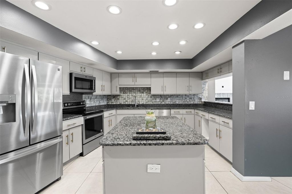 Photo of 14947 Lake Forest Drive, Lutz, FL 33559 (MLS # TB8489442)