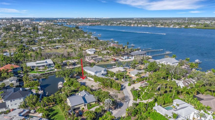 WATERFRONT ~ GREAT BOAT ACCESS  ~ Nearly half an acre of prime waterfront on beautiful Siesta Key. This oversized, cleared lot is ready to build—with no HOA restrictions and unlimited design potential. Ideally located just three homes from Sarasota Bay along a wide, deep-water canal with no fixed bridges, it offers sailboat access, an existing boat lift, and direct passage to the Intracoastal Waterway. Enjoy boating, fishing, kayaking, and breathtaking sunsets right from your backyard. *** Perfectly positioned near an array of dining, shopping, gourmet markets, boutiques, vibrant nightlife, and quaint cafés, this property blends convenience with coastal charm. Whether you build your custom retreat now or hold as a strategic long-term investment, this rare waterfront parcel offers exceptional value and future potential in one of Southwest Florida’s most sought-after communities.