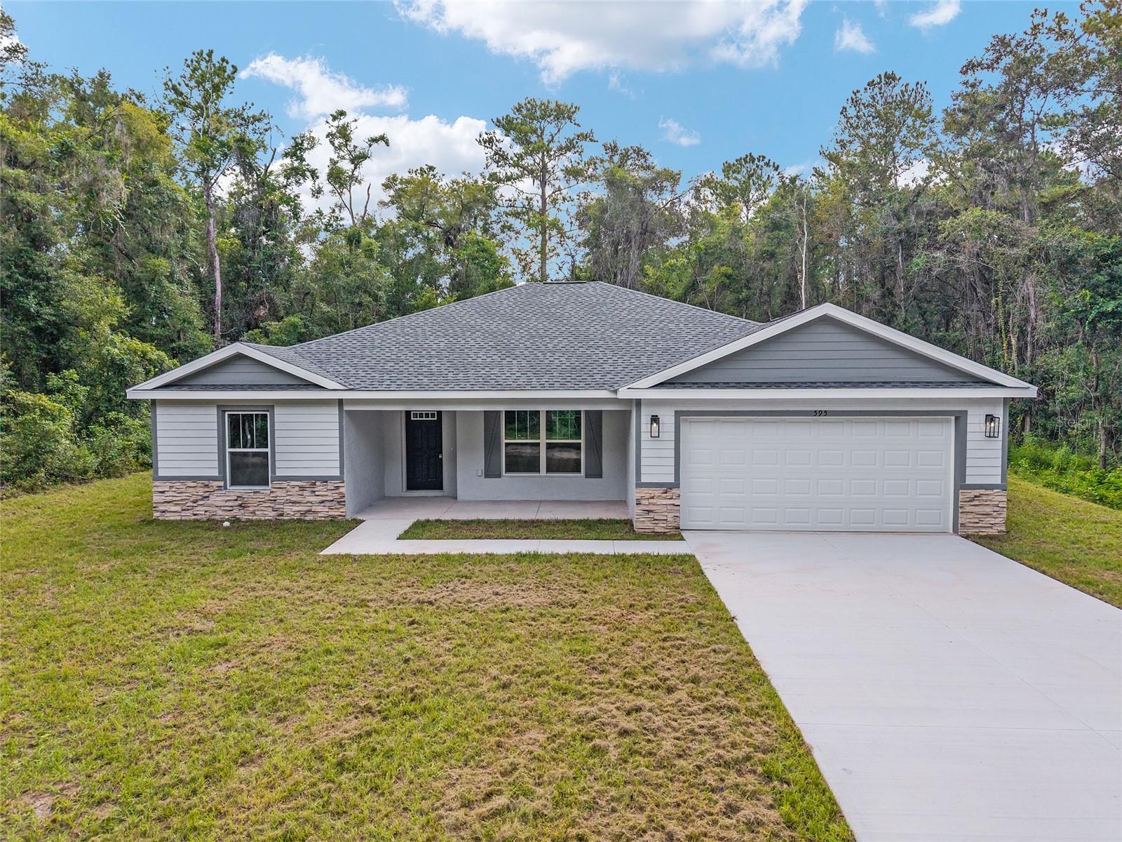 SELLER WILL PAY UP TO 10K OF BUYERS CLOSING COST! Fall in love with this beautifully upgraded 3-bedroom, 2-bath home featuring a spacious 2-car garage. The gourmet kitchen is a showstopper with quartz countertops, matching quartz backsplash, an oversized island, and modern light fixtures. Soaring 72-inch ceiling fans enhance the open-concept living area, creating both style and comfort. The master bedroom suite offers two walk-in closets and a luxurious en-suite bath with an expanded layout and a walk-in tiled shower. Enjoy Florida living at its best with a 20x8 covered lanai - perfect for relaxing or entertaining. This home truly combines elegance, function, and comfort in every detail. Just a short drive to Dunnellon, Crystal River and many local springs. Don't miss out, schedule your showing today.