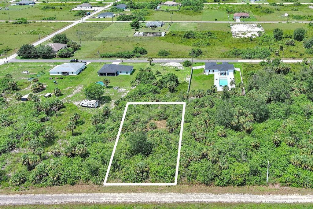 Photo of 1507 Hines Avenue, Lehigh Acres, FL 33972 (MLS # O6344053)
