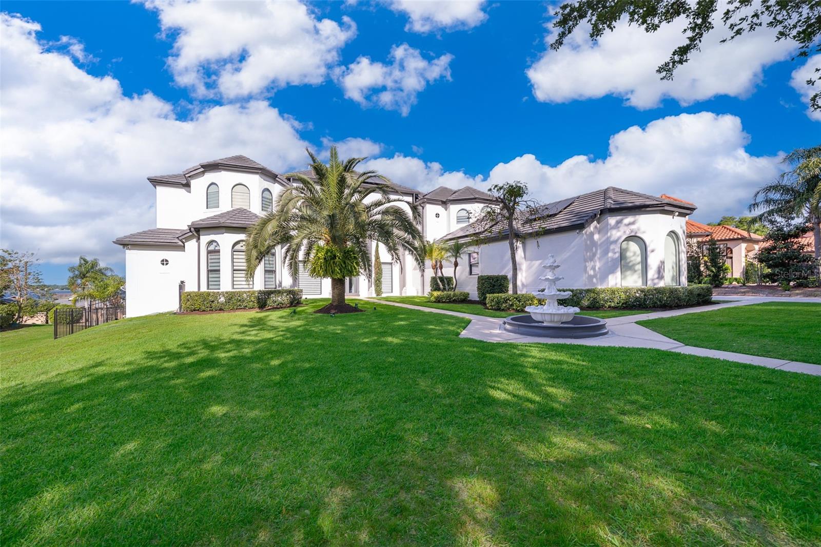 One of a Kind!!! Estate home in a Gated Community in the heart of Windermere, over looking Lake Down from a massive outdoor area with pool and lot of space to entertain in a 0.65 acre lot. The home has 6 Bedrooms and 4 1/2 Baths in an open floor plan that is been totally updated with brand new 52 High Impact Windows and 4 high Impact doors. The Master retreat is in the first floor, with a huge bathroom that will make you feel in your private spa, with walk in closet and beautiful views. The Kitchen and family room has been customize with moderns look that yours family and guest will share with you great times. The house has solars Panels that will make you save a tons of money on electric bills, is been also installed new water treatment system, souns Sonos System, Nest Termostats, Nest Smoke detectors, Nest door lock, switch smart Lutron, 16 security cameras in this house of the Future. Is been mounted 11 Tvs, and electric shades trough the house, designers wall paper and wood accent with led lights as been specially selected for each area of the home. The home was interior and exterior painted on 2024. This home is been fully updated and customize to bring a distinguish look and feel of a Family oriented home in a great location of the City with easy access to shopping, theme parks, restaurants, medical ans schools within few minutes and without highways.