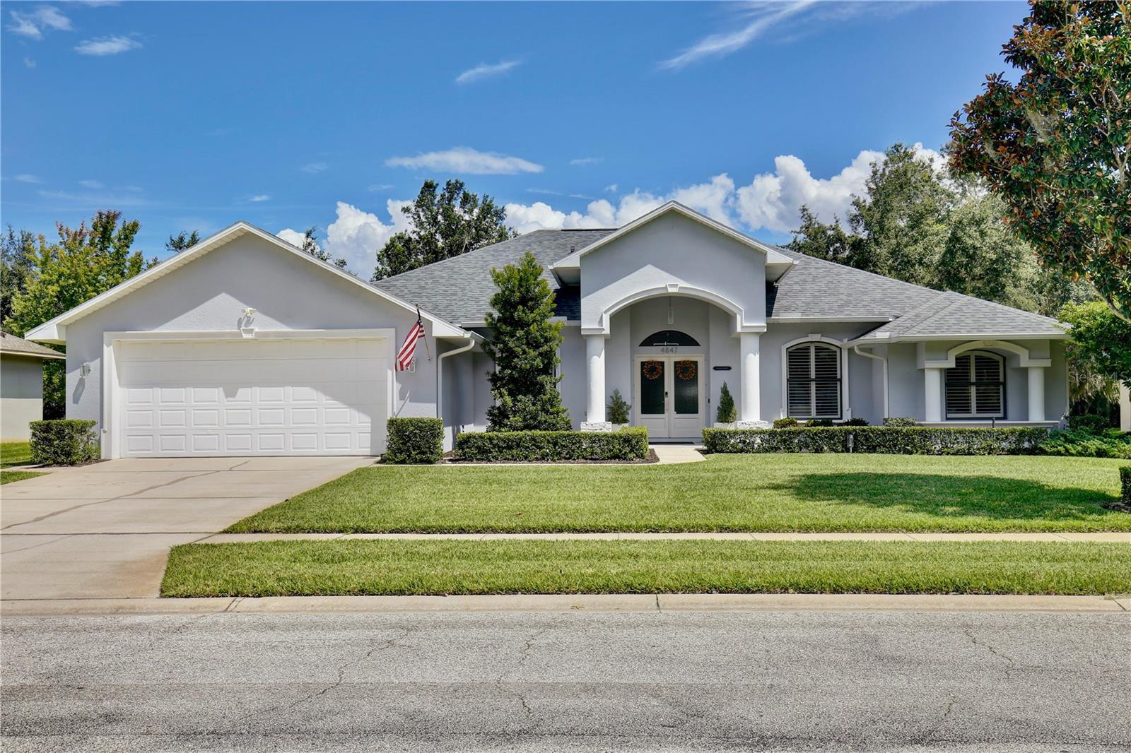 Discover the epitome of Floridian luxury living in this stunning fully remodeled waterfront home. Nestled in the gated community of East Lake Reserve, this property offers a serene oasis with its captivating curb appeal, meticulous landscaping, and breathtaking water views. Step inside to an open and airy interior boasting neutral colors, soaring ceilings, and stylish accent lighting. New wood style flooring flows throughout the home, leading you to a spacious living room that transitions seamlessly into an enclosed sunroom, perfect for soaking in the tranquil waterscape. The heart of the home is the newly remodeled kitchen, featuring stainless steel appliances, sleek modern cabinets, and bar top seating under elegant pendant lighting. Accentuated with decorative tile and recessed lighting, the space includes a convenient pantry and a cozy breakfast nook illuminated by a modern chandelier. Beyond the kitchen, the home offers versatility with formal living and dining spaces, currently utilized as a relaxing sitting room and a home office with plantation shutters and a chic glass door entry. The grand primary suite is a private retreat, with a walk in closet offering custom built ins and a hidden storage behind the mirror, perfect for storing shoes. The adjoining updated modern bath is a sanctuary complete with dual vanities and a colossal shower housing a freestanding tub amid exquisite tiling. Guests will enjoy the three additional bedrooms, complete with mirrored closets and plantation shutters. Updated guest baths feature glass door showers and beautiful tile work. A functional laundry room boasts storage cabinets, a sink, and a large folding station. Step outside to a beautifully landscaped outdoor space with a partially covered paver patio and water views, ideal for entertaining or unwinding with nature's soundtrack. Or walk across the street to the community’s boat dock and fishing pier to reel in a fresh catch for dinner. You’ll be a short drive from Orlando International Airport, Lake Nona Medical City, and 417. Spend the weekends browsing the quaint downtown streets of St Cloud, savoring the food trucks of Boxi Park, or go skating at the Ice Factory. There’s endless things to do in this amazing location! Immerse yourself in the 3D tour and schedule a showing to experience this dream home today.