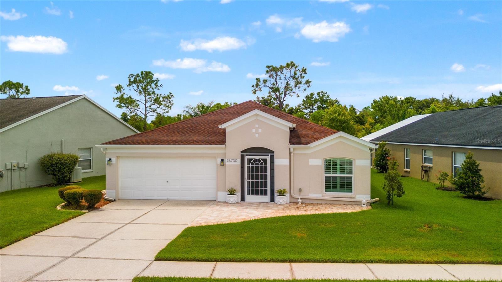 Wonderful home located on the 12th hole of the Lexington Oaks Golf Course. This four bedroom, two bath home has a two car garage with many upgraded features. As you arrive, you'll notice the enclosed exterior entryway, dressed with beautiful ceramic tiles with pavers leading up to the door. From there enter the home to the formal living and dining room. You will find ceramic tile throughout, with carpets in the bedrooms. The updated gourmet kitchen, features granite countertops with a center island, upgraded cabinets and a full appliance package,
including a smooth top range. Additional luxury continues with the starbursts shutters, found throughout the home. Both bathroom showers have also been upgraded. The family room gives a view of the fabulous large, enclosed lanai. When you’re setting on your lanai, you will feel like you have front row seating to enjoy all the golf course activities. There's a lot to appreciate about the Lexington Oaks Recreational Community, with all its great amenities for you to live your healthy active lifestyle. Starting with the 18 Hole Golf Course, full golf facility
with pro shop (variety of memberships available, or pay and play). Enjoy the Community Center that provides a full kitchen, conference, rooms, and space for entertaining, resort style swimming pool, wading pool, fully equipped fitness center, tennis courts, playground, sand volleyball court, basketball court and sidewalks throughout beautiful nature, landscaping for walking, riding bikes, running, and relaxing. There are two daycare centers that are conveniently located within the community. Lexington Oaks is conveniently located just west of I 75, with convenient commute to all Tampa Bay region areas, with convenient access to a large variety of shopping and dining, schools, as well as medical and public facilities. Do not miss viewing this gorgeous home.
