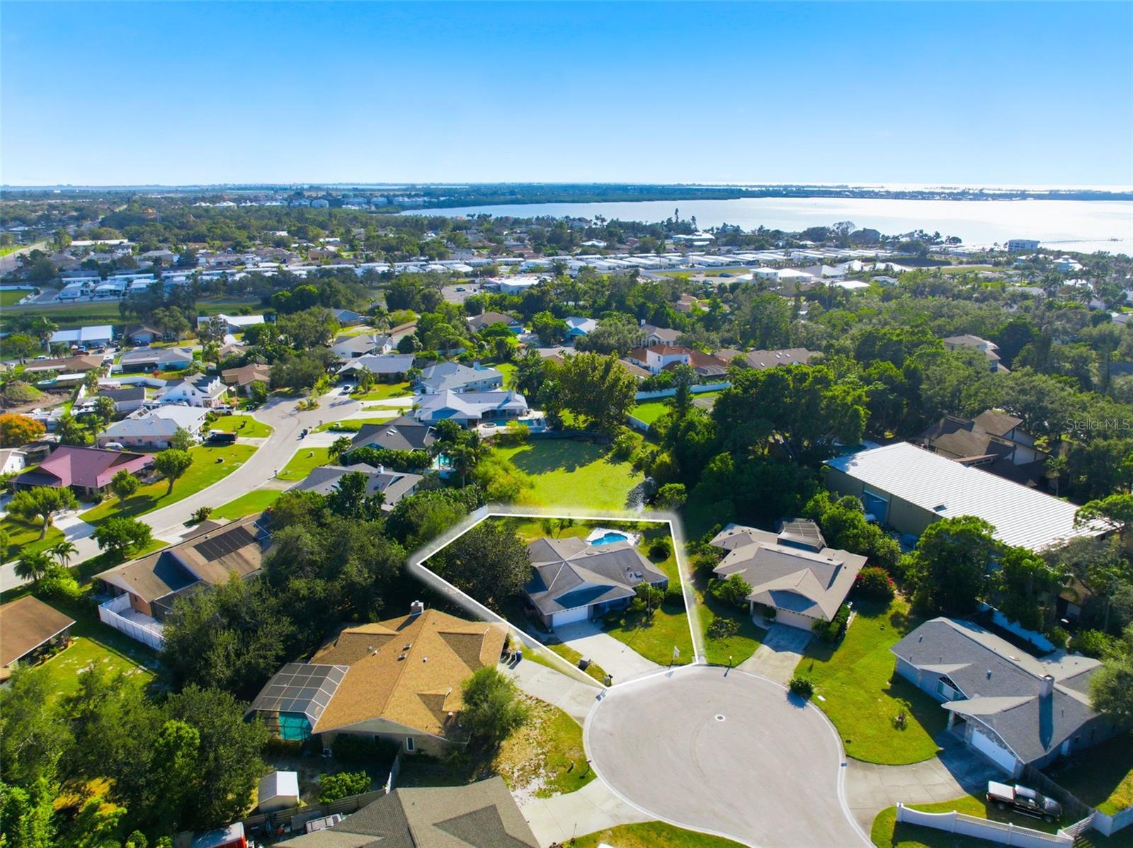 Located in one of the most desirable neighborhoods, PALMA SOLA WOODS II, just East of the Manatee Bridge and a hop skip and jump to get on Anna Maria Island.  Not only does this property have an amazing location but it's not often you find it on nearly as large of a piece of land and this one is just shy of a 1/2 Acre.  Built in the late 80's and owned and taken care of by the same family all these years.  The opportunity is now yours to bring it back to life and give it a "facelift".  The potential is screaming at you from every angle as the size, the floor plan, the land and location are all key factors when looking to make a home your own style.  Don't think twice this house is an amazing renovation project for the right person.  Top it off and you have no HOA fees or all the restrictions of most HOA communities.