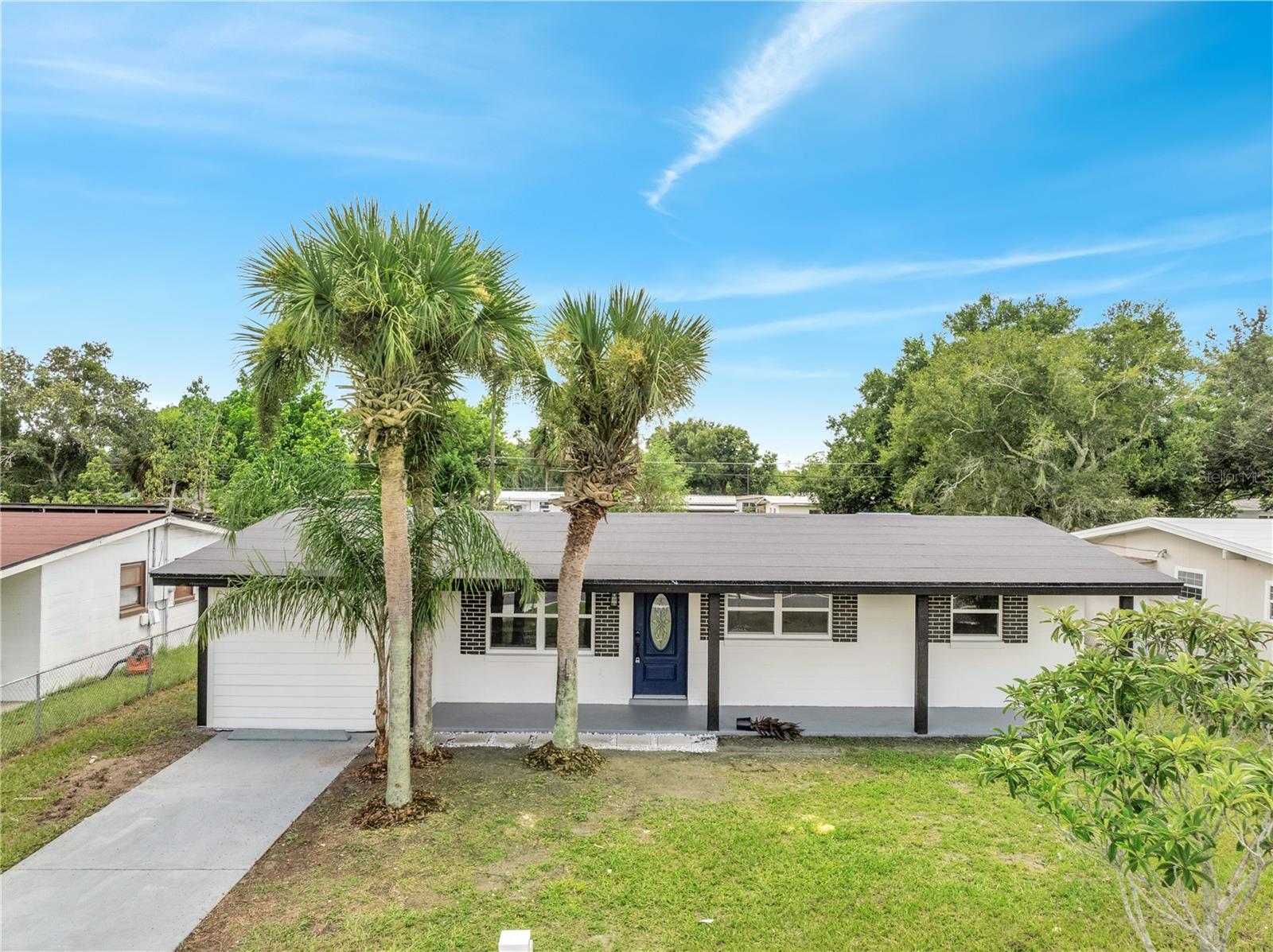 This beautifully renovated home offers a perfect blend of modern upgrades and classic charm. Featuring a brand-new Modified Bitumen roof installed in 2025, it ensures durability and peace of mind for years to come. Step inside to discover a fresh interior with stylish finishes, updated flooring, and a contemporary color palette. The open-concept layout connects the living, dining, and kitchen areas, creating a spacious and inviting atmosphere. The kitchen boasts sleek countertops, stainless steel appliances, and plentiful storage. Each bedroom offers comfort and natural light, with updated bathrooms showcasing elegant fixtures and finishes. Enjoy relaxing or entertaining in the expansive backyard—perfect for pets, gatherings, or even a future pool. The oversized lot provides endless potential for outdoor customization. With no HOA restrictions, you’ll have the freedom to personalize and use your property your way. A large driveway provides ample parking. Nestled in a quiet, established neighborhood with convenient access to shops, dining, and major roadways. Minutes to downtown Orlando, the airport, and top-rated schools. This move-in-ready gem is ideal for homeowners or investors alike.