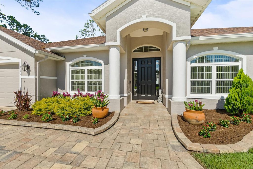 Photo of 116 Eric Drive, Palm Coast, FL 32164 (MLS # FC319751)
