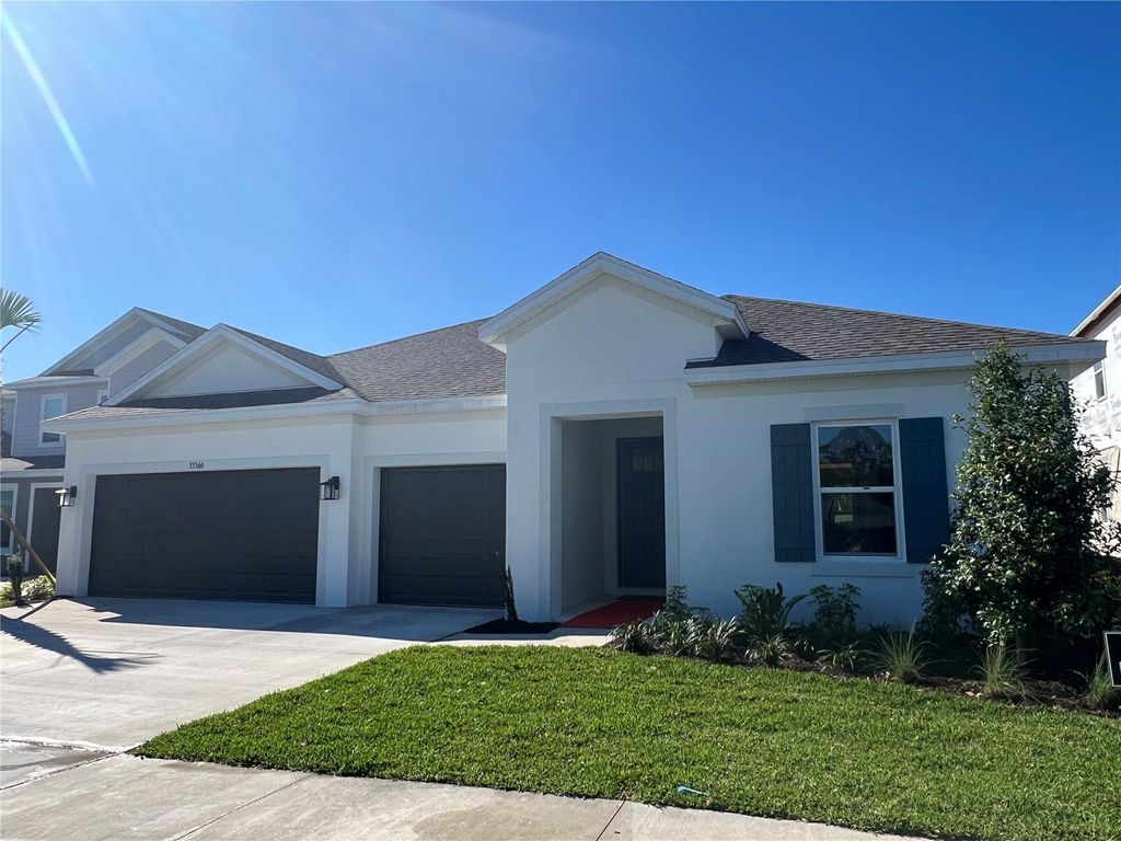 Photo of 33566 Landsman Loop, Wesley Chapel, FL 33543 (MLS # J974166)