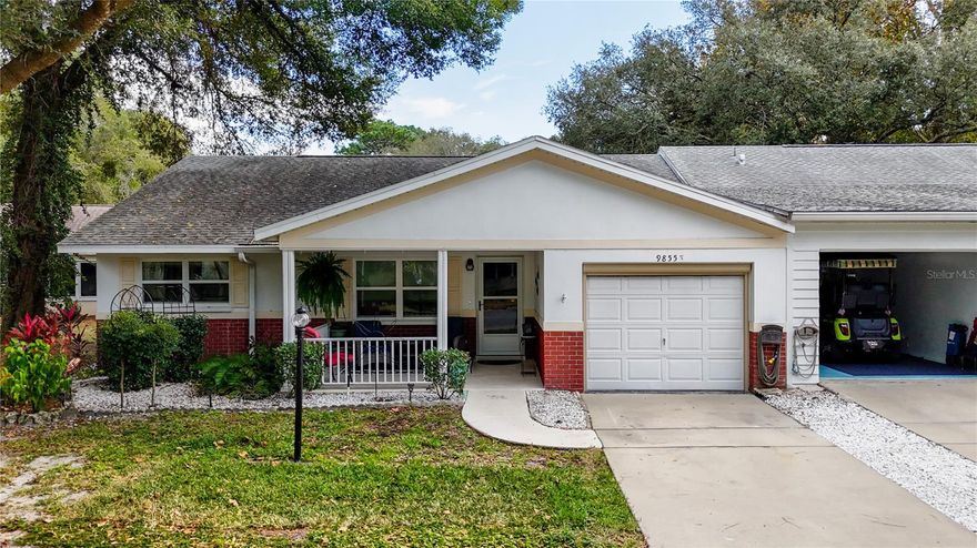 Concrete block end-unit villa located next to open green space and convenient guest parking. Updates include 2016 roof, 2019 HVAC, 2019 windows, and a 2019 screened lanai. Home has no carpet.

The updated kitchen features quartz countertops, new cabinetry, a breakfast bar, and a solar tube, and it opens to the family room. Living and dining areas provide ample space. The primary bedroom includes a walk-in closet and an ensuite bathroom with a walk-in shower. The guest bedroom is comfortably sized, and the guest bath has an updated ceramic tile walk-in shower.

Outdoor living options include a front porch and a screened lanai. The garage includes a screen door.

Conveniently located near shopping, dining, medical providers, and parks, with golf-cart access to nearby shopping centers.

The HOA fee includes lawn care, trash and recycling, basic Spectrum cable, roof repair, exterior painting every seven years, irrigation water, exterior maintenance and insurance, 24/7 monitored gates, and use of community amenities, including pools, fitness centers, three golf courses, clubs, and more.
