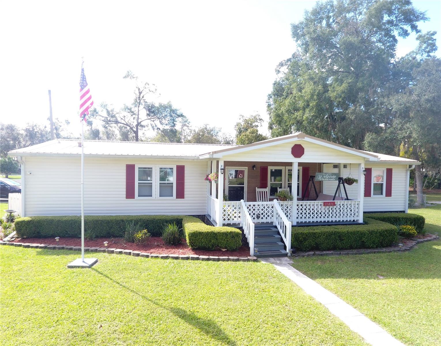 WHEN ONLY THE BEST WILL DO! ~ Springside deed-restricted 55+ subdivision, Chiefland, FL. 3 bed/2 bath 1512 sf inside but a whopping 2484 sf under roof! Property consists of two full lots on the corner of a paved road & trees line the southern side for privacy & seclusion in the back yard which is fully chain-link fenced with a double-gate entry to the detached 2-car garage. The home has many superior upgrades & amenities. For starters, the living areas & kitchen have beautiful pergo wood floors. The walls are taped & textured with drywall. The kitchen is a cook's delight boasting more than ample real wood kitchen cabinets with adjustable shelves, a lazy susan, a pantry with slide-out drawers & a pot rack. Under cabinet lighting really showcases the custom-tiled kitchen backsplashes. The kitchen/breakfast nook area is approx 19x13, & there is a separate dining room. The cathedral ceilings & open floor plan make it perfect for entertaining or just having lots of room to spread out & relax. Crown moulding along the ceiling & floor give it that finished look. There is a walk-in closet in EVERY bedroom. Each bath has a walk-in shower & both have linen closets. Central A/C & heating vents are in the ceiling & NOT the floor which saves on your electric bill & no ductwork to deal with, along with UV lighting in the return for sanitizing the air. New hurricane ready dual-pane windows with tinting are also energy efficient. In addition to the washer & dryer that are included in the sale, the laundry room has a storage closet & a pull-down ironing board for quick access & neat storage when not in use. The front covered entry porch is 18x8 with a swing to take in the beautifully landscaped front yard. A double-car carport provides back door entry steps to the laundry room & kitchen. The whole house water softener system is also located there. Behind the carport is a 13x12 screened porch that overlooks the gorgeous back yard & firepit. The detached two-car garage has been converted to a REMARKABLE workshop. It has 220V electric, generator plug-in, finished walls & flooring, a window A/C, sink, tons of cabinets & workbenches for all of your projects. There is a pull-down attic door where you can see all of the extra insulation that has been added to make this workshop super comfy, & of course an automatic garage door opener AND big screen TV! A large concrete walkway entry to the side door of the garage makes a great place to grill outside. An attached garden shed in the rear houses the generator which is also included in the sale with extra storage area. Community water & sewer, RV hookup, metal roof, gutters & downspouts, video security, & even a flag pole complete the picture. HOA is $50 per YEAR for each lot & pays for street lights & maintenance of the community front entry. You own the land, deed restrictions over 55 & no rentals. Just a short golf cart ride to Manatee Springs State Park & beautiful freshwater springs on the Suwannee River. Just around the corner is Clay Landing for launching your boat & down the road is the Chiefland Golf Course. Cedar Key is only 30 minutes away for waterfront dining & entertainment on the Gulf of America. Ocala & Gainesville are only a short drive away for equestrian activities & state of the art medical care. You definitely want to make an appointment to see this one! Move in & start enjoying the serenity you deserve in retirement. Brand-new condition Ashley furniture can be negotiated outside of the sale.