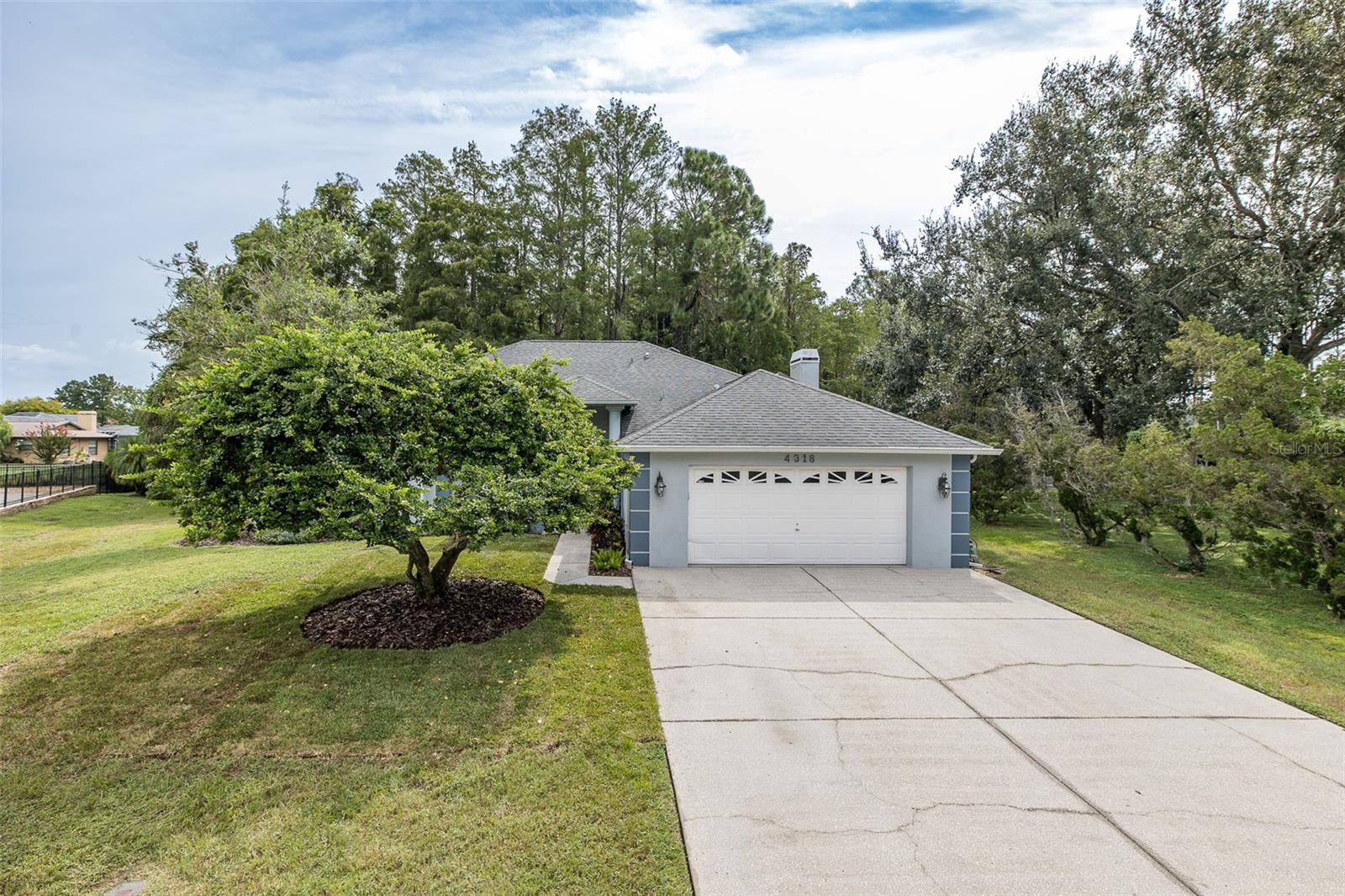 Welcome to this beautiful 4 bedroom, 3 bath, 2-car garage home tucked away on nearly three-quarters of an acre, offering both privacy and convenience. From the moment you step through the front door, the inviting open layout will make you feel right at home.
The living room seamlessly flows into the dining area and a very large kitchen, perfect for entertaining. The kitchen is equipped with a double sink, abundant cabinetry, and a cozy kitchenette dining space. Off the kitchen, you’ll find a comfortable family room with a charming wood-burning fireplace—an ideal gathering spot for special moments.
Enjoy Florida living at its best on the expansive screened lanai, accessible from the primary suite, dining room (via French doors), and kitchen. The lanai and outside patio paver space is perfect for hosting family and friends while taking in the peaceful tropical surroundings.
The split bedroom floor plan offers incredible flexibility. The primary suite, set apart for privacy, boasts a spacious walk-in closet and a luxurious bath with dual sinks, a soaking tub, separate shower, and private water closet. On the other side of the home, you’ll find three additional bedrooms and two full baths. One bedroom with an adjacent bath can easily function as an in-law suite, featuring its own hallway door for privacy and a separate outside entrance.
Set on a lush and private lot, this home offers the best of both worlds—a serene retreat with easy access to top-rated schools, shopping, dining, hospitals, and medical offices.
Don’t miss this exceptional opportunity—schedule your private tour today!