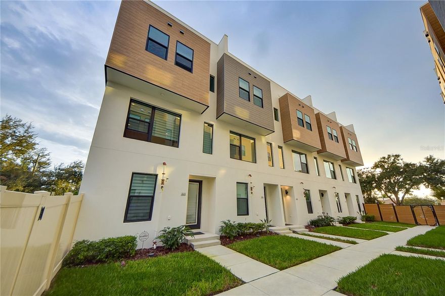 Enjoy living in this new townhome just minutes from downtown St. Petersburg and steps from Tropicana Field, offering the perfect blend of modern design, location, and value. Situated in the sought-after Alante community, this 2-bedroom, 2.5-bath residence with a flexible bonus space and attached garage delivers the lifestyle today’s buyers and renters are searching for—without the premium price of downtown high-rise living. Inside, you’ll find a bright, open-concept layout with luxury vinyl flooring and a beautifully appointed kitchen featuring two-tone wood cabinetry, quartz countertops, stainless steel appliances, and a striking backsplash. The living and dining areas flow seamlessly, creating an ideal space for both everyday living and entertaining. One of the standout features is the private ROOFTOP TERRACE, perfect for relaxing, hosting, or enjoying Florida sunsets—an amenity rarely found at this price point. The spacious primary suite offers a walk-in closet and a well-designed en suite bath with dual vanities and a walk-in shower. Additional highlights include a built-in wet bar, high-end window treatments, and an epoxy-coated garage floor with EV charger. Located in a rapidly evolving area just outside the downtown core, this home provides easy access to Central Avenue, the EDGE District, dining, shopping, and major roadways—making it an ideal choice for those seeking a downtown-adjacent lifestyle with more space, privacy, and value. With newer construction, modern upgrades, and a prime location, this property represents one of the best values for its size, condition, and proximity to downtown St. Pete. Located just four blocks north of Tropicana Field, this home delivers the ultimate urban lifestyle in one of St. Petersburg’s most dynamic neighborhoods. Owner will consider ease option/ lease purchase.