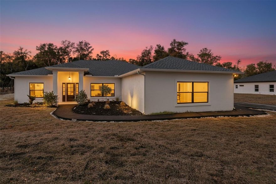 2026 CUSTOM NEW CONSTRUCTION | ENERGY-EFFICIENT | PREMIUM UPGRADES

Beautifully crafted 2025 custom-built home featuring 2,346 living sqft, 654 garage sqft, 243 rear porch sqft, 54 entry sqft with a total 3,297 sqft under roof.  An open-concept layout, soaring ceilings, luxury plank flooring, and a striking floor-to-ceiling modern fireplace that anchors the main living space. The designer kitchen offers quartz countertops, custom cabinetry, stainless steel appliances, geometric tile backsplash, and a large island with statement sink, perfect for everyday living and entertaining.

Quality craftsmanship shows throughout with real wood interior moldings, maple floating shelves, upgraded premium lighting, and a custom built-in drop zone at the garage entry. The spacious laundry room includes a utility sink, folding station, and additional storage.

Built with efficiency and durability in mind, this home features spray foam insulation in the attic and exterior walls, a StegoHome Wrap 15mil vapor barrier for moisture and radon protection, and a dedicated mechanical room housing the HVAC system, water heater, and electrical panel. Additional highlights include attic storage above the garage, upgraded Kohler Memoirs toilets, irrigation system with rain sensor, and a 10-year HVAC warranty.

The home is elevated 18 inches above the crest of the street for proper drainage, offering thoughtful construction and long-term peace of mind.

Move-in ready custom new construction with modern finishes, energy-efficient features, and quality craftsmanship throughout.