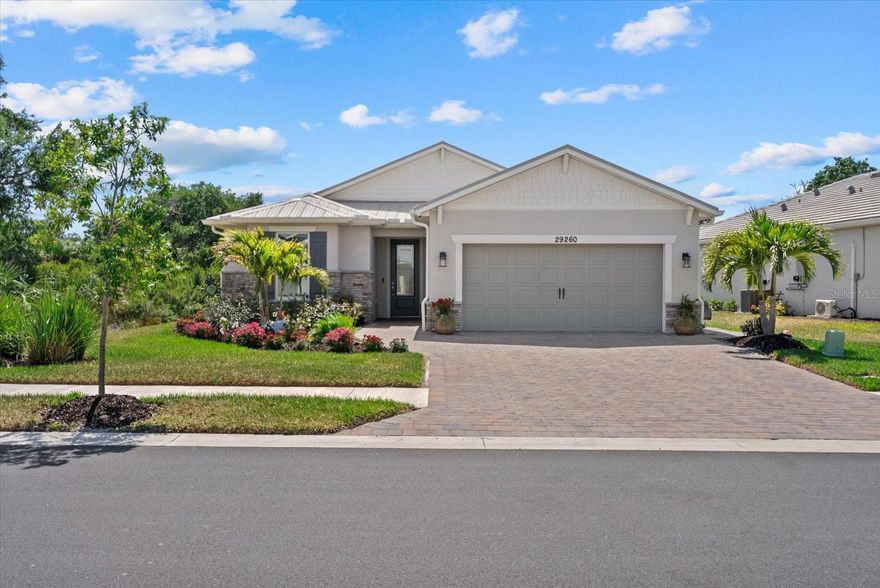 Why wait to build or settle for builder-grade finishes when this extensively upgraded coastal residence in BeachWalk by Manasota Key is already complete, enhanced, and move-in ready?

Situated on a premium preserve homesite with exceptional privacy, this 2024-built Smart Home offers a level of finish and functionality rarely found in comparable resale properties within the community. Over $100,000 invested in high-quality post-construction upgrades that would be costly and time-consuming to replicate today.

Designed for both luxury and livability, the home showcases an open, light-filled floor plan with high-end wood-look tile flooring throughout, 5” baseboards, crown molding throughout, tray ceilings, and 8’ doors. The spacious living area is a true showpiece, featuring a custom shiplap accent wall, new TV mount, electric fireplace with custom mantel, Sonos Surround Sound System, and zero-corner sliding glass doors that seamlessly connect indoor and outdoor living. The gourmet kitchen is equipped with quartz countertops, built-in cabinetry, natural gas cooktop, sleek hood, large island, pull-out drawers, soft-close cabinetry, and a walk-in pantry, making it ideal for both everyday living and entertaining. The luxurious primary suite offers a tray ceiling, custom accent wall, expansive walk-in closet with built-in shelving, and a spa-like ensuite with dual vanities, soaking tub, and walk-in shower with floor-to-ceiling tile.

In 2026, the Sellers added plantation shutters throughout, a custom primary closet system, garage mini-split A/C unit, insulated garage door, and blown-in attic insulation. They also widened the driveway and walkway, added outdoor coach lights, and extensively upgraded the landscaping with uplighting for an added resort-style feel.

The outdoor living space has been transformed into a private resort-style retreat with a heated PebbleTec saltwater pool and spa, expansive travertine decking, built-in outdoor kitchen, and tranquil preserve views — creating seamless indoor-outdoor entertaining and everyday enjoyment. The expansive screened lanai includes upgraded no-see-um screening, tongue-and-groove wood ceiling, and outdoor TV for year-round enjoyment.

Beyond aesthetics, this home delivers significant value through major structural and storm-protection upgrades including a metal roof, hurricane impact windows, Storm Smart shutters, whole-house 22kW generator with surge protection, and a carbon water filtration system — features increasingly sought after by Florida buyers and often absent in competing listings.

Unlike new construction, this property avoids the uncertainty, delays, upgrade premiums, and added expenses buyers face when building from scratch. Everything has already been completed with careful attention to detail, offering immediate enjoyment and peace of mind.

Located minutes from Gulf beaches, golf, boating, dining, and the growing amenities of BeachWalk, this is a rare opportunity to own one of the community’s most thoughtfully upgraded homes. 

Beachwalk by Manasota Key is a gas community with no CDD and low HOA fees, offering resort-style amenities including a clubhouse, fitness center, resort pool and lap pool, spa, pickleball, tennis, bocce ball, dog park, community garden, lakeside boardwalk, and on-site dining. Enjoy the perfect blend of luxury, privacy, and lifestyle in this exceptional home.