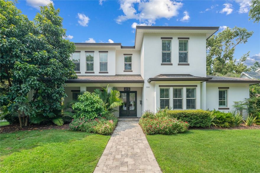 Discover luxury living in this custom Austin Homes 5 bedroom, 5 and one half bath transitional style home that offers a blend of modern and traditional elements coupled with a highly desirable Winter Park location. This residence boasts a sought-after open floor plan with 12-foot ceilings, wide plank wood flooring and truly exceptional detailed finishes throughout. You will feel instantly at home as you pass through the fully enclosed front yard and enter through the double door entrance from the covered wrap-around front porch. The open-concept design seamlessly connect the dining room and family rooms as you make your way to the kitchen area complete with Wolf & Sub-Zero stainless-steel appliances, double islands, Wellborn custom cabinetry, and private Butler's Pantry with new washer/dryer. The gourmet kitchen opens to the spacious family room where you will find a built-in fireplace with custom millwork, recessed lighting, and beautiful French doors that open fully to the outside entertainment/living area. The split floor plan is perfect for the family and as you find your way throughout the remainder of the home, you will be impressed by the designer window treatments, plantation shutters, built-in speaker system, high-quality upgraded light fixtures, and private pool bath. The main floor includes a spacious primary retreat with a large walk-in closet and private French doors leading to the pool area. The spa-like bathroom includes a stand-along soaking tub, dual sink with stone counters and generous walk-in shower. The formal dining room and en-suite guest bedroom complete the first level. Upstairs are 3 spacious bedroom suites with full baths, a generous bonus/media room with built-in desk, and a second upstairs laundry room with hook ups. You will enjoy Florida living while relaxing on your covered lanai complete with retractable screens and summer kitchen overlooking the saltwater sparkling pool/spa with new pool heater and fully enclosed kid friendly yard. Upgrades include: Control 4, new electronic driveway entry gate, whole house interior and exterior painting, Jeld Wen solid core interior doors, hardwood floors throughout the first floor & bonus room, custom closet systems in all closets, rare 3-car garage, vinyl insulated windows, core fill & block walls, high density spray foam insulation in ceilings, R13 in frame walls, Carrier 15-Seer AC dual systems with UV filtration, and two Rinnai gas tankless water heaters, whole house water filtration. This pristine residence is situated on an oversized corner lot and it truly timeless, move-in ready, and only ½ mile to the Winter Park Raquet Club and 2 miles to famed Park Avenue to enjoy incredible dining and boutique shopping. Call now for your private tour!