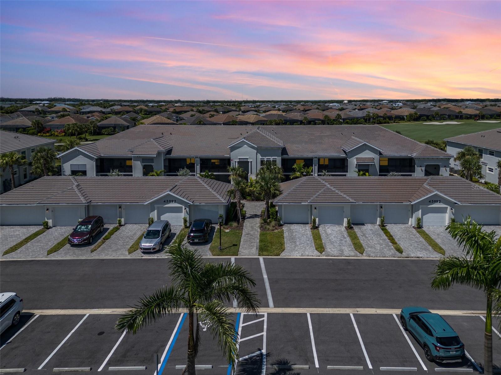 Turnkey Social Condo with Golf & Water View. Arabella Floor Plan in Babcock National. Live your best life in Babcock National, where luxury meets leisure in one of Southwest Florida’s most sought-after resort-style communities. This exquisitely maintained TURNKEY furnished Social Membership condo offers the perfect blend of comfort, elegance, and vibrant community living—all without the added cost of a golf membership. Perched in a prime location with sweeping golf course and water views, this spacious Arabella floor plan features an open-concept design flooded with natural light, creating a warm and welcoming atmosphere. The master suite is your personal sanctuary, complete with two walk-in closets and a spa-inspired ensuite bathroom. A second bedroom and den provide flexible space for guests, a home office, or additional living. The gourmet kitchen is as functional as it is beautiful, boasting quartz countertops, modern stainless steel appliances, and abundant cabinetry. Whether you're cooking a quiet meal at home or entertaining guests, the flow between the kitchen, dining, and living spaces is effortless. Step outside and enjoy true indoor-outdoor living with both a front and rear lanai—perfect for sipping morning coffee as the sun rises or enjoying evening cocktails with breathtaking sunset views over the golf course. Additional highlights include a detached garage, ideal for a vehicle or golf cart, and TURNKEY furnishings that make moving in a breeze. Resort-style living at its finest awaits you in Babcock National. Residents enjoy access to an expansive main pool and spa, along with three satellite pools conveniently located throughout the community for added relaxation. A dedicated lap pool is perfect for fitness-focused swimming, while the full-service spa offers a luxurious retreat for ultimate rejuvenation. The state-of-the-art fitness center is equipped with modern exercise machines, saunas, and locker rooms, supporting an active and healthy lifestyle. For recreation and social connection, residents can take advantage of the clay tennis courts, pickleball courts, and bocce ball courts, all designed to enhance outdoor enjoyment. Dining options are equally impressive. The Watershed Grill offers casual poolside dining and refreshing beverages, ideal for relaxed afternoons in the sun. For a more refined culinary experience, the newly opened Enclave Restaurant in the elegant clubhouse features gourmet cuisine and handcrafted cocktails in a beautifully designed setting. Whether you’re seeking a seasonal retreat or year-round haven, this condo offers a seamless blend of upscale living, community energy, and tranquil surroundings—all within the gated beauty of Babcock Ranch's premier golf and lifestyle destination Babcock National.