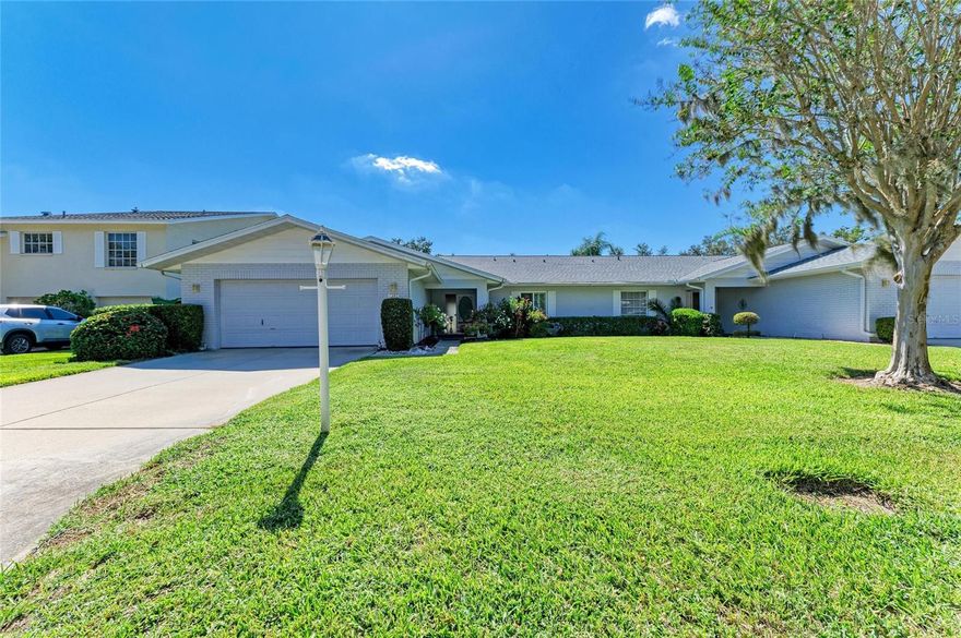 You won't want to miss this open and spacious two bedroom, two bath Maintenance Free Villa with a den/office (possible third bedroom). Located in desirable Pinehurst within the Palm Aire Country Club Neighborhood. This home is nestled in this lovely quiet serene neighborhood. You will find this home features a large open living room/dining room with vaulted ceilings, an updated kitchen with new granite counter tops/backsplash, island and newer stainless steel appliances.  Spacious primary bedroom features a private bath and over sized custom walk-in closet. The second bedroom also features its own custom walk in closet. Tiled bonus/sunroom off the living room provides additional living area. Easy to maintain luxury vinyl recently installed in living room, kitchen, primary bedroom, and office. An abundance of storage throughout  this home as well as an inside utility/laundry room.  Spacious two car garage  provides additional storage and refrigerators. Roof was replaced in May 2023 and HVAC in 2019.  Community pool, Clubhouse for special events you might want to host along with tennis courts. Close to Rt 75, Downtown Sarasota, Bradenton and the Beautiful Gulf Beaches, Golf Courses, UTC Mall, Mote Aquarium, shopping and dining. This is the perfect location to enjoy the Florida life style. Located adjacent to Palm Aire Country Club, membership is not required but multiple membership levels are available through the country club.