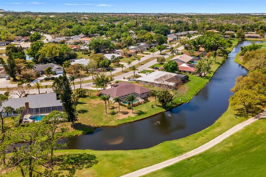 Oversized lot (nearly ½ acre) with stunning views of the lake and golf course fairway! This home offers incredible potential and is being sold AS IS, with major updates already completed—including a new roof (2025), A/C (2024), and impact windows (2019).Inside, you’ll find a desirable split floor plan with soaring cathedral ceilings and spacious living areas. All bedrooms feature walk-in closets, and newer luxury vinyl plank flooring enhances the dining room, living room, and family room. Four sliding glass doors open to the lanai—three of which pocket—creating a seamless indoor-outdoor living experience. Enjoy the expansive covered lanai area and free-form in-ground pool, perfect for relaxing or entertaining. The oversized kitchen offers abundant space, including room for a dining table, plus two pantries for extra storage. A separate laundry room adds convenience. The oversized 610 sq ft garage includes a dedicated golf cart space with a side entry door—ideal for larger vehicles and extra storage. A circular driveway provides ample parking and curb appeal. Kitchen and bathrooms are ready for your personal updates, making this a fantastic opportunity to customize and add value in a prime setting. Discover the ultimate in unrestricted living. Walk or ride your golf cart to Conservatory Park, ideal for kayaking, fishing, and hiking. Minutes from UTC, Benderson Park, SRQ Airport, and Sarasota’s pristine beaches, shopping, and dining, this home embodies the best of Florida living. Don’t wait—schedule your private tour today! Optional membership in the Palm Aire Country Club offers amenities including two championship golf courses, tennis, pickleball, fitness center, dining and more. This exceptional property comes with NO HOA NO CDD and NO DEED RESTRICTIONS