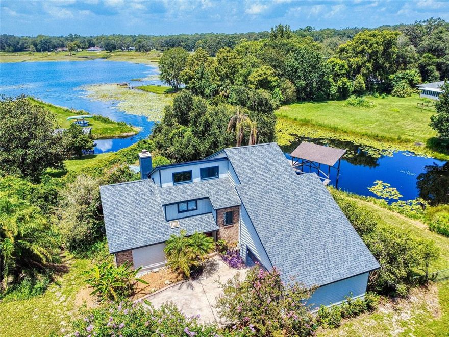 STUNNING LAKE front home on SMITH LAKE on this oversized private island-oasis lot!  This wonderful lake house is surrounded by awesome lake views from all areas of property.  High ceilings with natural light thru out, split floor plan with large master and master bath downstairs, eat in kitchen with dinette area and a snack bar for entertaining! New Roof and exterior house painted 5/25!  Extras include living room fireplace, woods and tile floors thru out, master suite with dual sinks and garden tub and a separate shower, large walk-in closet, indoor laundry room, 2nd floor loft or study or 2nd living area, oversized 2 car garage, screen porch, gazebo, decks and docks for boats, jet skis, canoes, kayaks or just sitting and enjoying the sunrises and sunsets!  Bring your toys, RV, boats etc.  NO HOA here, come view to be impressed.  3D walk thru tour is in the attached website!  Call for your private showing today!!!!