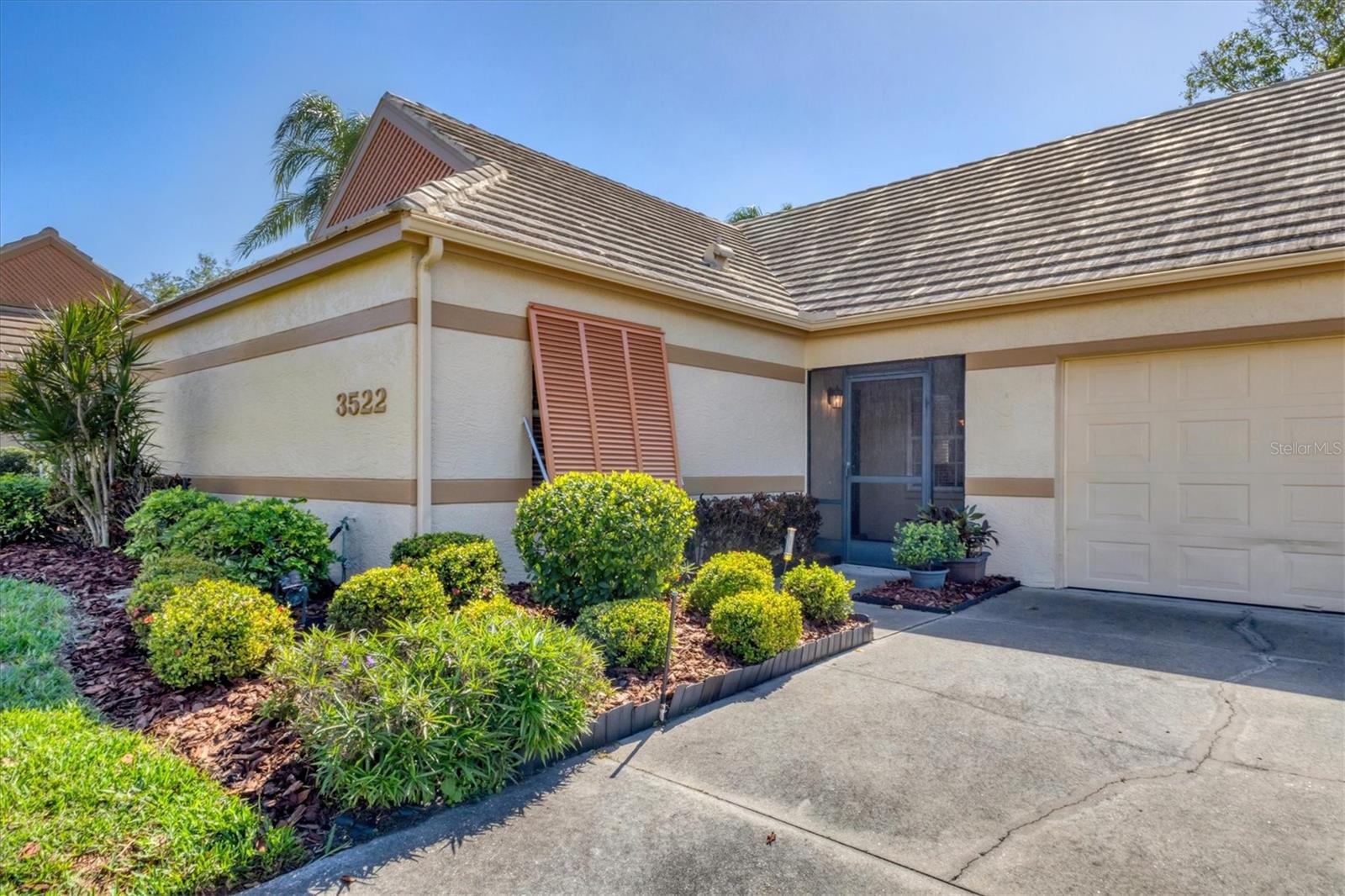Welcome to this beautifully maintained 3-bedroom, 2-bathroom villa offering a serene and peaceful pond view. Perfectly designed for comfort, this home features a spacious layout with vaulted ceilings, creating a bright and open atmosphere throughout. The oversized 1-car garage provides plenty of storage, while the screened lanai with vinyl panels ensures year-round enjoyment, no matter the weather.
Located in the popular Lakebridge community, a prime spot with easy access to plenty of shopping, dining, and entertainment options. This residence is also just a short drive from IMG Academy, making it an ideal choice for those seeking convenience and fun. Whether you're enjoying the peaceful pond view, partaking of a game of tennis or a swim in the community pool or exploring the nearby amenities, this villa offers the perfect balance of comfort and location. Don’t miss out on this fantastic opportunity to own a truly well-maintained home in an unbeatable location!