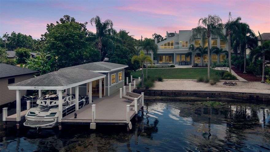 Located directly on the WINTER PARK CHAIN OF LAKES, this house was built in 2007 and COMPLETELY REMODELED in 2014, presenting this stunning contemporary home located ON LAKE MINNEHAHA. Featuring 4 bedrooms, 3.5 bathrooms, a flex room, laundry room, heated pool/spa, summer kitchen, covered boat dock with lift, a grandfathered-in boat house and a 2-car garage for a total of 4,868 sqft! The kitchen is appointed for a chef with THERMADORE INDUCTION RANGE, DOUBLE OVENS, SUB ZERO refrigerator and freezer, WINE CHILLER, THERMADORE dishwasher, an in-drawer microwave and built-in custom cabinets. The kitchen also features a beautiful full-size ISLAND with QUARTZ countertops with space for stools and a breakfast nook perfect for a round table and 8 chairs overlooking the pool. Just off the kitchen resides the laundry room, UPGRADED IN 2019 with built-in cabinetry by Walka Wood Co, an LG washer/dryer and an additional Whirlpool fridge/freezer. The dining room opens to the kitchen with room to hold a dining room table that seats 12 with a custom built-in buffet, cabinetry for storage and custom lighting. The living room located off the dining room, features a FLOOR-TO-CEILING WOOD BURNING FIREPLACE with mirrored DOUBLE MARBLE SLABS and has sliding glass doors opening to the SUMMER KITCHEN and outdoor area. On the opposite side of the kitchen and perfect for entertainment, is a PROFESSIONAL MOVIE THEATER/FAMILY ROOM with floor to ceiling windows and 22 ft high ceilings! The Owner’s Suite is DOWNSTAIRS with beautiful lake views, custom cabinetry, 2 closets and a large master bath.  Upstairs there are 3 bedrooms /2 bathrooms and a flex space with beautiful lake views perfect for an office, playroom, or gym. The upstairs gives access to a 1,600 square foot balcony with panoramic lake views that was just RENOVATED IN 2023. Don’t forget the backyard! This is where you will want to spend your time with your family and friends. As you travel to the lake, you pass the heated pool, spa and summer kitchen continuing to the lake you walk through the lush grounds to your sanded beach area and 133+ FEET OF LAKEFRONT on LAKE MINNEHAHA including a grandfathered in 600 SQUARE FOOT BOATHOUSE! There is a COVERED BOAT SLIP, with an automated lift, that will accommodate a Nautique g21 (21 foot+, 5800 lbs.+.)  The DOCK WAS RESURFACED IN 2015 with trex composite decking boards, installed with no surface nails. Freshly painted in 2023 - no detail was missed in this exquisite property! Centrally located to Winter Park, Park Ave, I-4 and great shops and restaurants. Call today to see 130 Minnehaha Circle in-person or virtually! <a href='https://www.zillow.com/view-3d-home/94654f0a-5608-47e8-9e61-e1fec6bd93fd?setAttribution=mls&wl=true&utm_source=dashboard'>https://www.zillow.com/view-3d-home/94654f0a-5608-47e8-9e61-e1fec6bd93fd?setAttribution=mls&wl=true&utm_source=dashboard</a>