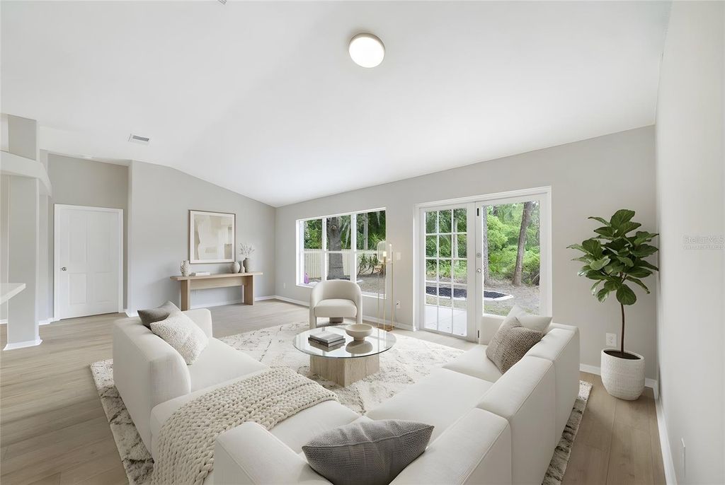 Photo of 13850 Riverpath Grove Drive, Orlando, FL 32826 (MLS # O6394875)