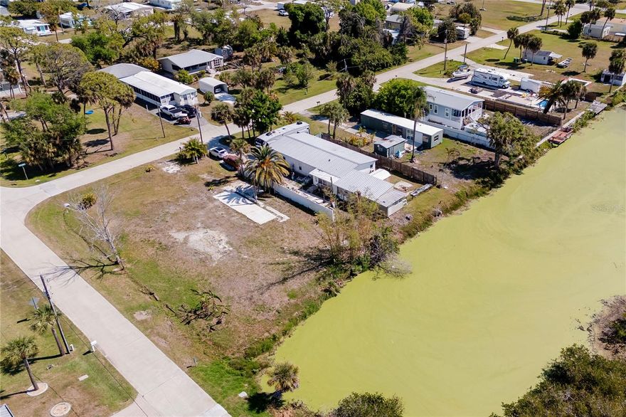 PRICE DROP TO $60000 FOR THIS WATERFRONT LOT.    Located in the peaceful Pine Lake community of Englewood (Grove City area), 8195 Pinetree Lane offers a charming opportunity to own a slice of Florida living.  This property sits on approximately 0.22 acres, providing a comfortable lot size  70x140 with room for outdoor enjoyment and future inhancements.Drive through the community and preview this lot.