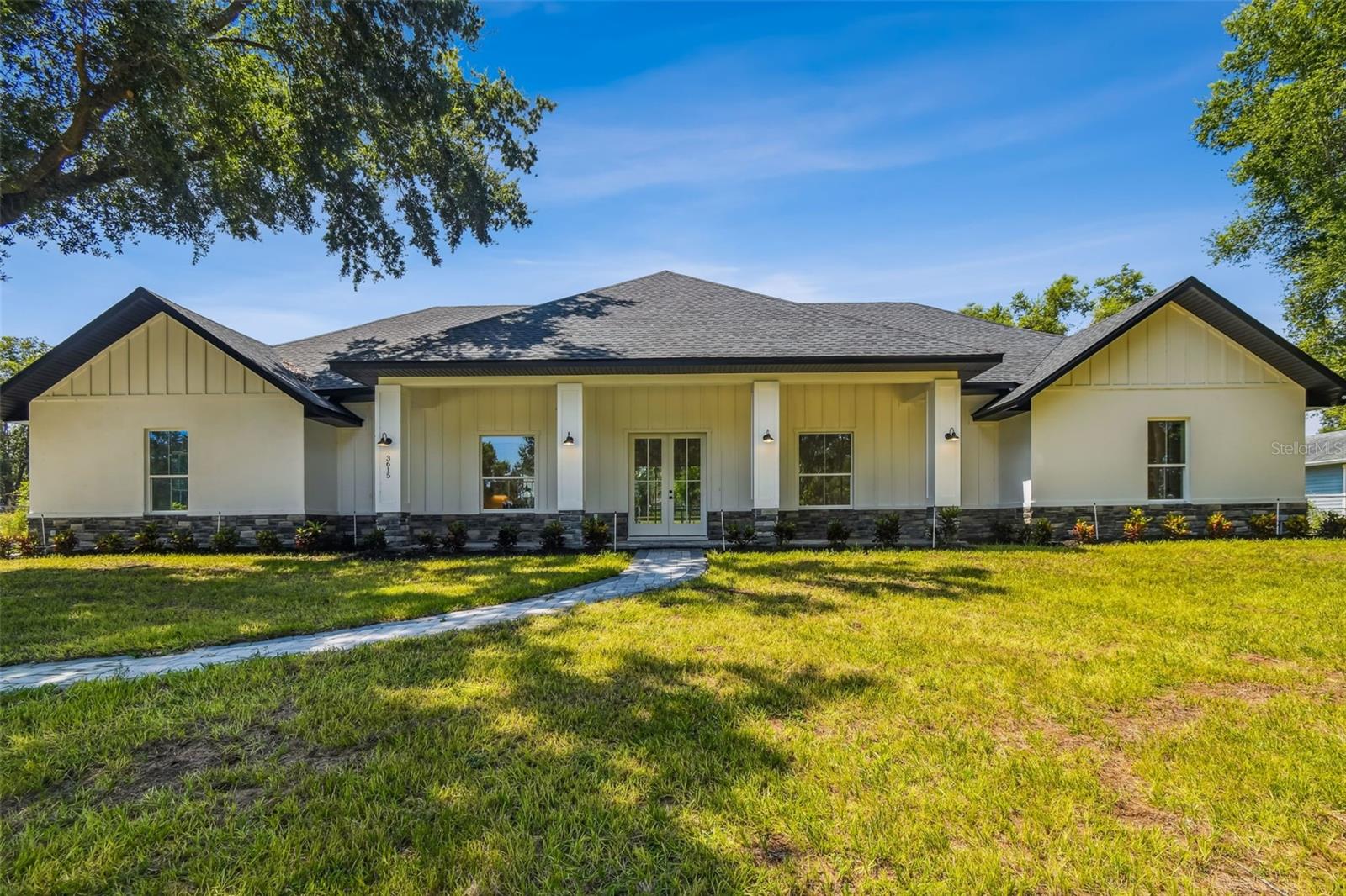 Welcome to your dream home in the heart of Plant City! Built in 2025, this stunning 4-bedroom, 2-bathroom home offers 2,755 square feet of beautifully designed living space on 1.33 acres of land.
From the moment you arrive, you’ll be impressed by the eye-catching paver driveway and charming large front porch, perfect for enjoying your morning coffee. Step inside to find gorgeous wood-look ceramic tile flooring throughout—combining the elegance of hardwood with the ease of tile maintenance.
The home features soaring ceilings and an open layout that feels light, bright, and spacious. The modern kitchen is a chef’s dream, complete with sleek stainless steel appliances and a clean, contemporary design.
The primary suite is a true retreat, offering a spacious bedroom, a luxurious en-suite bathroom with dual sinks, a soaking tub, a private toilet room, a walk-in shower, and an oversized walk-in closet.
Outside, enjoy Florida living at its best with your own in-ground pool, surrounded by beautiful pavers, ideal for relaxing or entertaining. The 2-car garage offers ample storage and convenience.
Don’t miss the chance to own this exceptional home in a highly desirable location—schedule your private tour today!