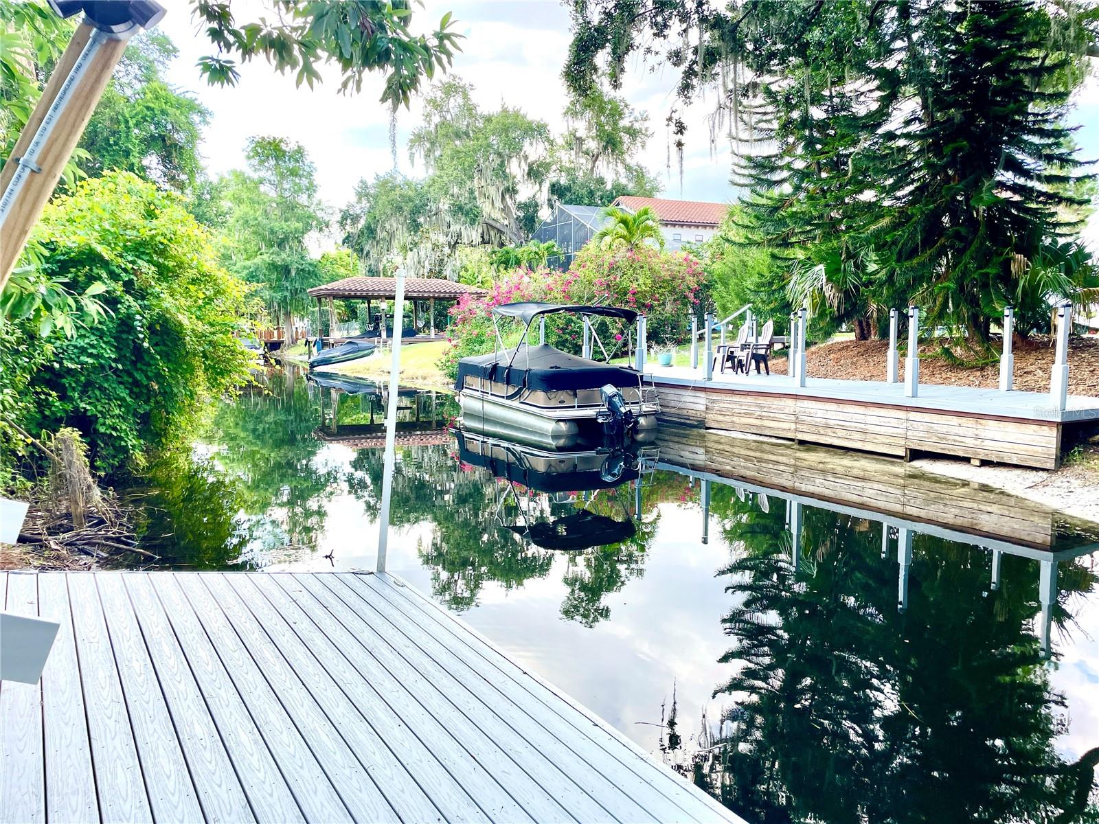 Spectacular waterfront home situated on the **BUTLER CHAIN OF LAKES** with over 75 feet of canal connecting you to Lake Down and Wauseon Bay. Tie your boat up to a new 20 foot dock with power and enjoy the water everyday. The home has many NEW features to fall in love with and ample space to enjoy the Florida life! Plenty of indoor and outdoor room for all of your toys, so bring your boats, cars, motorcycles and RV's. Sitting at over 3200 sq ft, this lovely home has it all, starting with 3 spacious bedrooms and bathrooms (all with UPDATED Glass Shower doors), recent RENOVATED BATHROOM, NEWLY INSTALLED LUXURY VINYL TILE FLOORING on the staircase leading to the UPSTAIRS BEDROOM & HUGE BONUS ROOM, lighting and ceiling fans throughout, a brand NEW A/C handler and recently painted inside and outside, there is no corner left untouched on this gorgeous property. An immaculate chef’s dream eat-in kitchen and dining area features brand NEW CABINETS, QUARTZ countertops, an oversized island, farm sink, stylish fixtures, subway tile backsplash, and stunning stainless steel appliances with a large fridge! You will find yourself spending every morning drinking coffee on the completely renovated MASSIVE UPPER DECK made of Brazilian Cherry Wood where you will take in the pristine natural scenery that sits before you and enjoy many lovely sunsets in the evenings. There is plenty to occupy and entertain guests here, including the brand NEW FLOATING DOCK with power outlet and lights, Huge COVERED LANAI, OVERSIZED DOUBLE GARAGES to house your Boat, Water toys, fishing poles and **EXTRA RV PARKING** on the side yard. This is the perfect rental that makes everyday feel like summer, situated on a large lot on over a quarter of an acre, where you will have fun in the Florida sun and have endless adventures on the water with friends and family. You will be sure to impress having the Canals intersect and connect 11 LAKES ON THE BUTLER CHAIN!! Included in the monthly rent is quarterly pest control and weekly lawn maintenance! This home is in a highly desired location in downtown Windermere known for top desirable schools, only 20 minutes from the popular Orlando attractions and just an hour from local beaches, you are in a prime spot also close to dining, shopping and much more! House will have some final touches being completed and being professionally cleaned prior to your move in! Call today to book a tour and make this home your reality