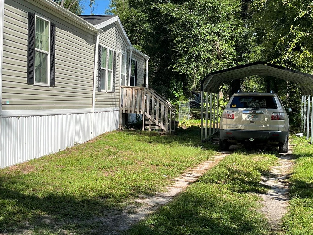 Photo of 10452 County Road 136, Live Oak, FL 32060 (MLS # O6423698)