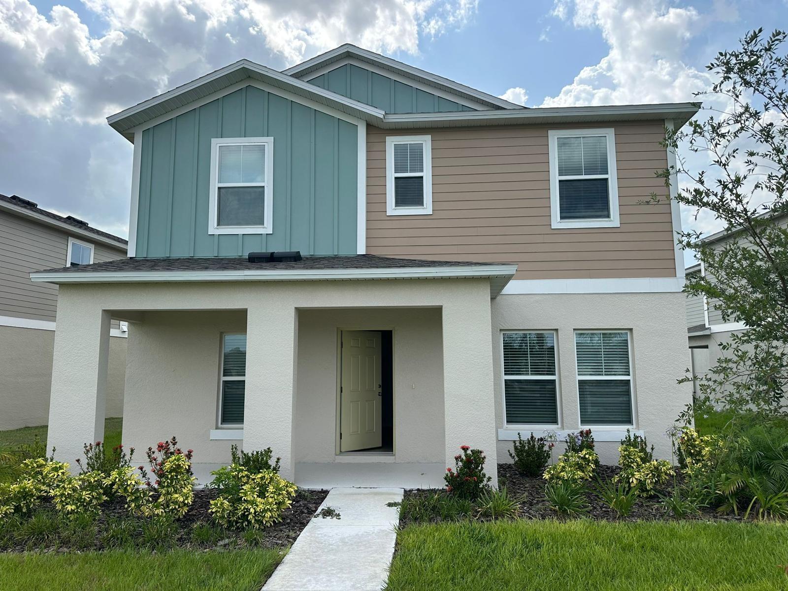 READY NOW! Experience the spacious luxury of the Lago, a beautifully designed two-story, 4-bedroom, 2.5-bathroom, 2-car garage home. Enter through the charming front porch with professionally designed landscaping to the open-concept floorplan, creating an ideal setting for entertaining or relaxing. with a convenient half bath located off the kitchen. The kitchen itself is a dream, featuring sleek quartz countertops, new stainless-steel appliances, and a large island that overlooks the living and dining areas all set on luxury vinyl plank flooring. Follow the sliding glass doors out to the patio for true Floridian lifestyle, effortlessly mixing indoor and outdoor living. Upstairs, the laundry room is conveniently located near the generously sized bedrooms, including a luxurious owner's suite. The owner’s bathroom is impressive with a walk-in shower, double vanity and an oversized walk-in closet. The rear-load garage and smart thermostat with voice control add to the home's modern conveniences, making the Lago a perfect blend of style, comfort, and practicality, fit for any lifestyle. Step into a home designed for today’s lifestyle—contact me today!