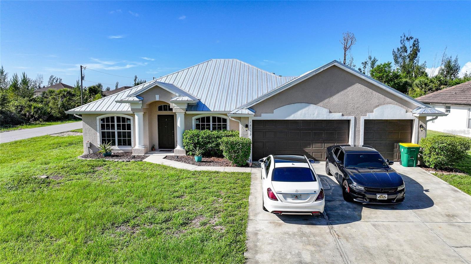 ANNUAL RENTAL in South Gulf Cove! This is a large corner lot home with 2,126 s.f under A/C 4 bedrooms plus 2 bath, and 3 car garage and a driveway for another 3 large vehicles. This split plan home boasts with many upgrades - new metal roof, freshly painted interior, new AC, new hot water heater and LED lighting. The home features separate living and formal dining rooms, 42" wood cabinets in the kitchen, cultured marble in both bathrooms and Corian kitchen counter tops, 18" tile in kitchen and family room. The rest of the house boasts with wood grain tile for an elegant look. Master bedroom has tray ceiling, separate walk in closets. Master bath features garden tub, separate shower and two separate bathroom sinks. All bedrooms and family room have ceiling fans along with two ceiling fans on the porch. Washer and dryer hookups in inside laundry room. Located in the beautiful South Gulf Cove water community with over 50 miles of canals. The home is minutes from the community boat ramp and park with easy gulf access. You can easily bike to the waterfront parks. Close to beautiful Gulf beaches, golfing, shopping and world class fishing. No smoking is allowed in the house. The ideal tenant earns 3 times the monthly rent; has NO history of evictions, the ability to clear the background screening and a good credit history. No Application fee! Please be aware of scams, we will never ask you to wire money. First and last month rent and Security Deposit of $2500 is due on or before move in. Will be move in ready August 1st.