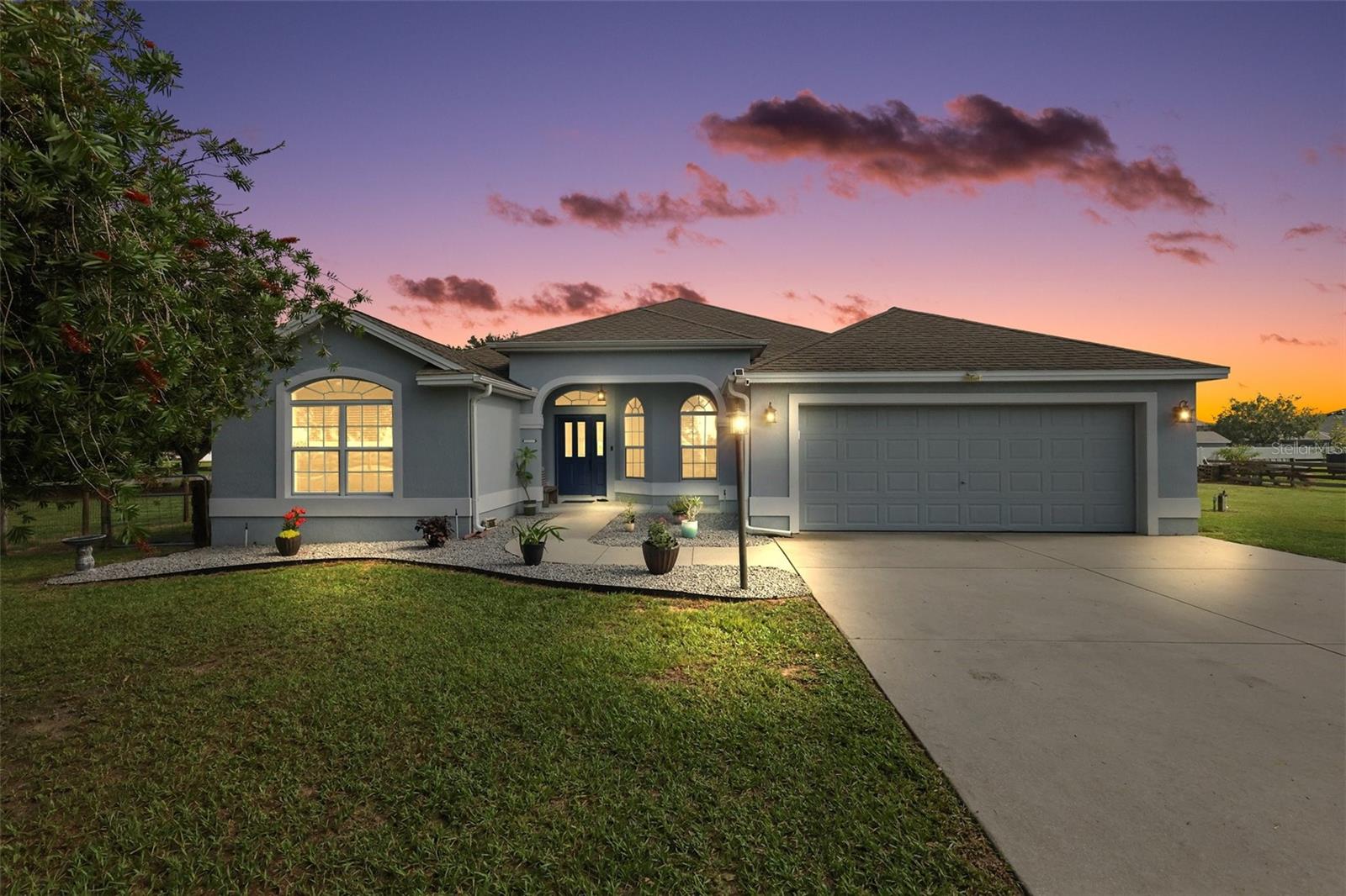 RARE OPPORTUNITY! ONE+ ACRE PROPERTY with TWO BLOCK and STUCCO HOMES, swimming POOL, 30’x50’ WORKSHOP, and an under-air SHED conveniently located in Fox Hollow II ! NO HOA! JUST MINUTES from The Villages and 466A, 301, and 466 with an ABUNDANCE of shopping, restaurants, banks, medical, and more! This beautiful property is perfect for multigenerational living, income potential, or simply enjoying extra space and freedom. The FENCED YARD has a GATED ENTRANCE for privacy and security. The 2,072sf MAIN RESIDENCE boasts 3-bedrooms and 2-baths. The GORGEOUS kitchen features staggered CHERRY cabinetry, GRANITE countertops with pull-outs, diagonally TILED backsplash, STAINLESS appliances, GAS cooking, built-in PANTRY, EAT-IN counter, TILE floors, and an adjacent DINETTE. An OPEN-CONCEPT living and dining area offers VAULTED CEILINGS, TILE flooring, and built-in entertainment center with bookcases and a gas FIREPLACE. Sliding glass doors, from the living room, lead you into the FABULOUS lanai and POOL area - the perfect place for entertaining friends and family! From the lanai, step outside to your above-ground POOL, complete with a CUSTOM DECK and grilling patio. ENJOY Florida living at its best as you soak up the sun on the deck, dive into the refreshing POOL, or simply sit and enjoy the BEAUTY of this BACKYARD PARADISE! Back inside, the primary bedroom features LAMINATE floors, TRAY ceiling, and DOUBLE WALK-IN closets. It’s en-suite bathroom offers TWO CHERRY vanities with GRANITE tops, TILED ROMAN-STYLE shower, separate water closet, and a LINEN closet. Two additional bedrooms and a second bath, CONVENIENTLY hidden behind a POCKET DOOR, ensure plenty of PRIVACY for guests or a quiet home office. Bedrooms two and three both offer LAMINATE floors, VAULTED ceilings, and built in closets. The second bathroom features a CHERRY vanity with GRANITE top, and a TILED tub and shower combination.The INTERIOR LAUNDRY ROOM boasts cabinetry, shelving and UTILITY sink. It leads to the 644sf GARAGE with attic access stairs, shelving, and an additional refrigerator. The 820sf SECOND HOME is ideal for guests or rental income. It features 2-bedrooms and 2-baths, PRIVATE ENTRANCE, and a wonderful 18’x11’ SCREENED FRONT PORCH! VAULTED ceilings and LVP flooring grace the main living area. The MODERN kitchen boasts WHITE cabinetry, GRANITE tops, TILED backsplash, STAINLESS appliances, and an ISLAND with EAT-In counter. Both bedrooms feature TRAY ceilings and LVP flooring. The primary bathroom has WHITE cabinetry with GRANITE top and a TILED ROMAN-STYLE shower. The second bathroom offers a vanity with GRANITE top and a TILED tub/shower combination. A French door, from the kitchen, leads to a rear patio and entrance to the 130sf INTERIOR LAUNDRY/STORAGE room. Bring your tools, toys, or business dreams—this property is fully equipped for all your storage and workspace needs with plenty of parking for RVs, boats, and trailers. RV 50-amp hookup. The 30'x50' WORKSHOP with FOUR BAYS offers ABUNDANT SPACE for mechanics and hobbyists. There’s also a detached SHED with electricity and a/c. Whether you're looking for a multifamily setup, room for a home-based business, or simply a property with space and flexibility, this rare find has it all! DON’T MISS YOUR OPPORTUNITY to make this AMAZING PROPERTY YOUR OWN! Please watch our walkthrough video and call today to schedule your Private Showing or Virtual Tour and explore all the possibilities this property has to offer!