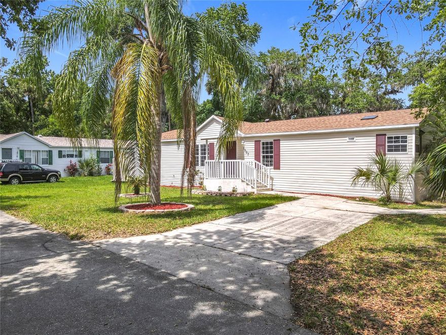 Welcome Home! Come see this beautiful REMODELED Home, OWNED LAND – NO LOT RENT, located on a corner lot in the heart of New Smyrna Beach in a quiet neighborhood. This charming property is the perfect place to call home, Step inside and you'll find a spacious and inviting interior, complete with an open floor plan. fully REMODELED Kitchen with NEW cabinets, NEW QUARTZ counter-top and NEW Appliances, NEW Roof, Fully REMODELED master bathroom and guest bathroom, NEW light Fixtures, NEW Ceiling fans with remote control,  NEW interior paint, a very nice deck in the back and a 680 sq foot workshop for your favorite hobby! this beautiful House is conveniently located just minutes from the beach, local shops and restaurants.
