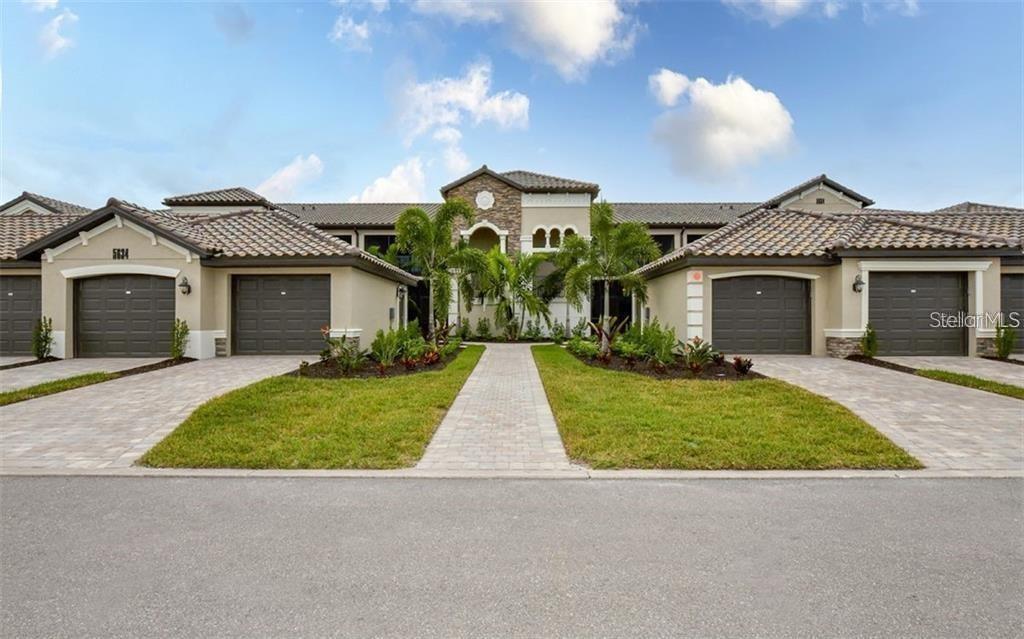 Beautiful second floor end unit 2BD/2BA condo plus a den is located in the premier gated community of Lakewood National and offers stunning views of the fairway. Enjoy gorgeous sunny days and cross breezes on your private front and back lanai. Clever open floor plan lends itself to Florida style living and entertaining. Nicely appointed kitchen boasts stainless steel appliances and granite counters. Primary bedroom boasts en-suite bathroom with double sinks and large walk-in shower. Plenty of room for guests and family. Separate detached 1 car garage. Entertain guests and enjoy meals as you watch the golfers navigate the Arnold Palmer designed golf course from your very own lanai! Just a short walk to amenities that include clubhouse with restaurant & tiki bar, fitness center, resort style swimming pool, outdoor grills, poolside service, full-service spa, tennis courts, pickleball, bocce ball and more! Golf membership transfer is available. Easy access to I-75, local shopping and dining, Sarasota airport and much more! **$65 monthly minimum expenditure is required at the tiki bar/on-site restaurant (alcohol excluded).**