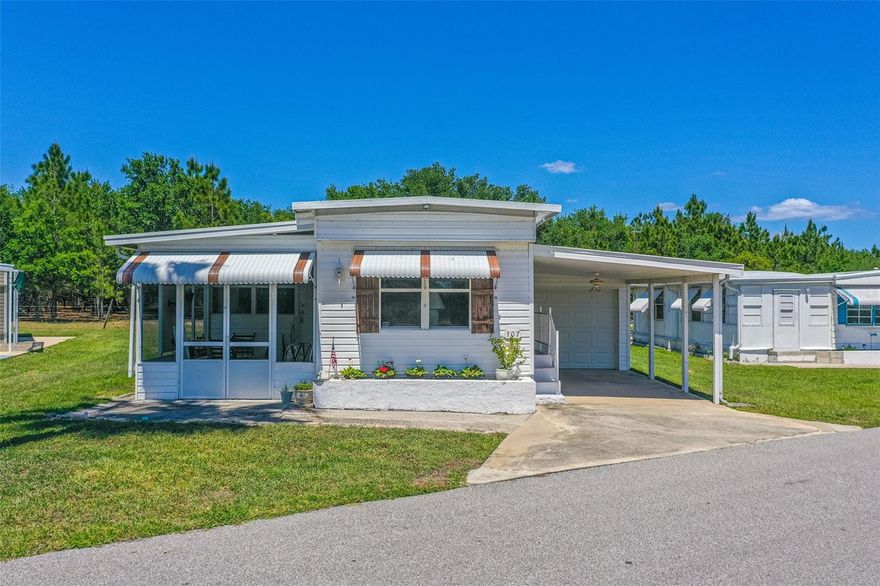 Welcome to this charming and well-maintained 3-bedroom, 2-bath home offering approximately 1,046 sq. ft. of comfortable living space in a peaceful and more private section of the community. Surrounded by beautiful mature trees and open green space, this property offers a serene country-style setting where horses and cows often wander nearby, creating a truly relaxing Florida lifestyle.

Step inside to discover an inviting open floor plan with spacious living and dining areas enhanced by warm wood flooring, creating a cozy yet functional atmosphere. Natural light flows throughout the interior, making the home feel bright and welcoming for both everyday living and entertaining guests. The kitchen features a water filtration system under the sink that is negotiable with the sale, while the water softener system will not convey. Kitchen items are staying with the home, offering added convenience for the new owner.

The spacious primary suite includes both a tub and shower, while the second bathroom features a shower and conveniently houses the washer. The dryer is located in the utility room. A screened front patio provides the perfect place to enjoy morning coffee, unwind in the evenings, or simply take in the peaceful surroundings year-round.

Additional highlights include a NEW AC installed in 2024, a 1-car garage, attached carport, and an outdoor 6x7 storage shed for extra storage. The roof is approximately 21 years old, and according to the available 4-point inspection, it has an estimated remaining life of approximately 19 years. Seller currently has a 4-point inspection available. Refrigerator and freezer in the garage may not convey.

ALL FURNISHINGS ARE NEGOTIABLE, including the living room couch, chairs, tables, lamps, dining room furniture, kitchen table, large TV with TV stand, and furniture in one of the guest bedrooms. The white wicker bedroom furniture will not convey. Items displayed on the walls and patio furniture are excluded from the sale.

Community amenities and services include water, sewer, cable, internet, lawn maintenance, clubhouse access, and a community pool, providing added convenience and a low-maintenance lifestyle. Conveniently located near Highway 27, shopping, dining, medical facilities, golf courses, and local attractions, this home offers easy access to Winter Haven, Haines City, and Orlando-area destinations. Enjoy being just a short drive from the scenic beauty of Bok Tower Gardens, nearby lakes and parks, Downtown Lake Wales, and LEGOLAND Florida Resort.

Whether you are looking for a full-time residence, seasonal retreat, or investment opportunity, this property offers privacy, comfort, and the charm of Central Florida living.