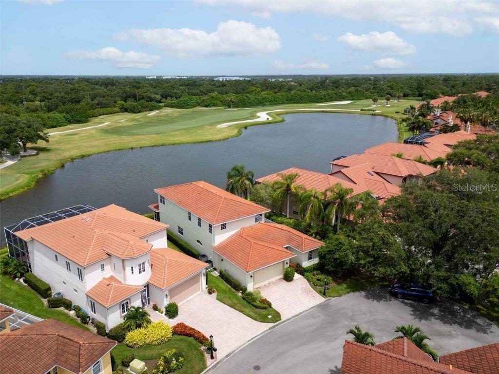 This quaint villa in TPC Prestancia offers abundant space, forever water and golf course views, and the ease of maintenance-free living. Set behind the gated entry of this lovely community, you’ll sense the open spaces and immaculate grounds of this incredible Sarasota neighborhood which is centrally located and in the heart of Palmer Ranch. Upon entering the courtyard entry, you’ll feel the privacy of your patio area and see the front doors main home as well as the separate self-contained guest suite/casita! The first floor features open views and chef’s kitchen with plenty of storage that opens into a large entertaining area. The owner’s suite is on the ground level with stunning views and features dual walk-in closets. The second floor of this home features two en-suite guest rooms and an office space as well. Notable features include diagonally laid tile and wood floors, upstairs balcony, crown molding and detailed trim throughout, and gorgeous custom stair railings. TPC Prestancia has an amazing golf facility and social membership options, however no membership is required with this home. This Palmer Ranch location allows for easy proximity to shopping, groceries, Gulf beaches and the Legacy Trail. Schedule your private showing today.