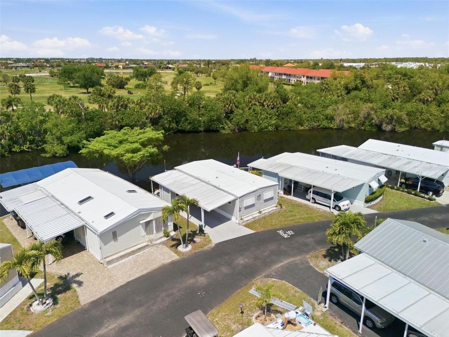 Welcome to the BEST PRICED WATERFRONT HOME in Punta Gorda! Parkhill Estates is a 55+ mobile home community located just South of Punta Gorda- conveniently located near Publix, Home Depot and Walmart. This home is located on Alligator Creek with serene views of the flowing water and a multitude of wildlife every day- from fish to birds, manatees and alligators! Go fishing from your own dock less than 15ft. from your back door or just relax on the glider (included) in the shade and watch the boats go by. 
This  quaint 2 bedroom, 1 & 1/2 bathroom residence comes completely turn key- bring your toothbrush and fishing pole and start your sunny Florida lifestyle. Enjoy the heated community pool, an afternoon of bocci or a fun evening of Bingo, This is a very active and friendly community.
NO PETS ALLOWED. NO rentals. This property is a co-op - buyers must purchase a minimum of 10 shares at $1000 each outside of purchase price (up to 16 shares- monthly fees are on sliding scale based on number of shares owned). Fees include water, sewer, trash pick up, lawn care, and use and maintenance of recreational facilities.