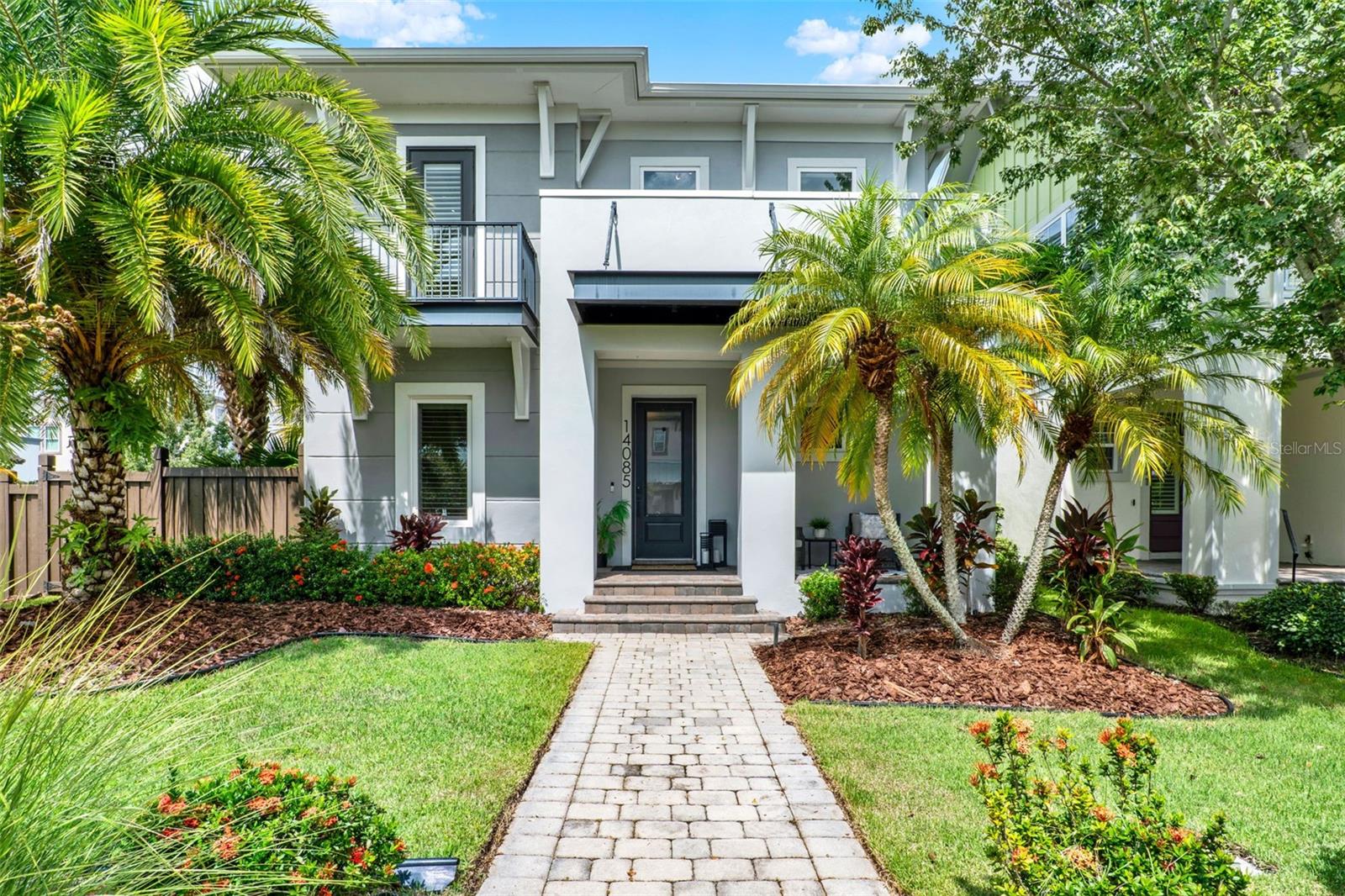 ***Backyard Bliss, Entertainer's Dream***Welcome to 14085 McFadden Lane, a beautifully appointed corner-lot home in Laureate Park, perfectly situated on a lush green space in one of the most private and desirable pockets of the community. Just a short walk to Laureate Park Elementary, this residence offers the ideal blend of walkability, privacy, and convenience. With just under 2,300 square feet, this 3-bedroom, 2.5-bath home features a spacious open-concept layout that flows effortlessly for both everyday living and entertaining. The gourmet kitchen is the heart of the home, showcasing rich cabinetry, granite countertops, double ovens, and an oversized center island that opens seamlessly to the living spaces. Just off the kitchen, the expansive dining area easily seats 12+ guests and transitions smoothly to the covered porch, creating the perfect indoor-outdoor setting for hosting gatherings or enjoying quiet evenings. Step outside and enjoy a true entertainer’s paradise with two covered lanai spaces and a fully fenced, pavered backyard oasis, beautifully landscaped with tropical foliage for maximum privacy. There’s also plenty of room to add a pool, creating your own private resort-style retreat. All three bedrooms are located upstairs, including the expansive primary suite with a spa-like bathroom featuring dual vanities, a walk-in shower, and a jetted soaking tub, plus access to a private balcony overlooking the backyard. One of the secondary bedrooms includes a charming Juliet balcony with tranquil views of the green space out front, the perfect touch of character. ** Additional highlights include planation shutters, an oversized 3-car garage with ceiling-mounted storage racks, an 8 kW solar array (fully paid off), a NEMA 14-50 EV outlet for electric vehicle charging, a built-in office nook, and a spacious laundry room with custom cabinetry. The living room also features a 7.2 surround sound pre-wire, and the upstairs balcony is pre-wired for speakers to extend your living space outdoors.nTucked away in one of Laureate Park’s best locations, this home offers a rare combination of thoughtful design, modern upgrades, indoor-outdoor living, and proximity to top-rated schools, parks, trails, and amenities. Schedule your tour today!!!