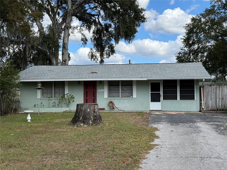 Solid block home, two-bedroom 1 bath home with Florida room. Only used seasonally, well maintained over the years. Large 60x140 lot with alley way behind home and shed. It has an eat-in kitchen and split bedroom layout. There is a large indoor utility/laundry room with washer and dryer. The roof is one year old and it has a paved driveway and a back yard that is fenced in. This home has a lot of potential. The home is being offered to rent furnished. If applicant wants their own furniture, we will remove existing furniture. Super great location. 3 blocks to elementary school and high school. 3 blocks to grocery store. Seven blocks to downtown main street with a couple restaurants and other entertainment establishments. 2 hours drive or less to beaches, theme parks, major airports, sports venues and more! Move right in with ease! Hurry!!