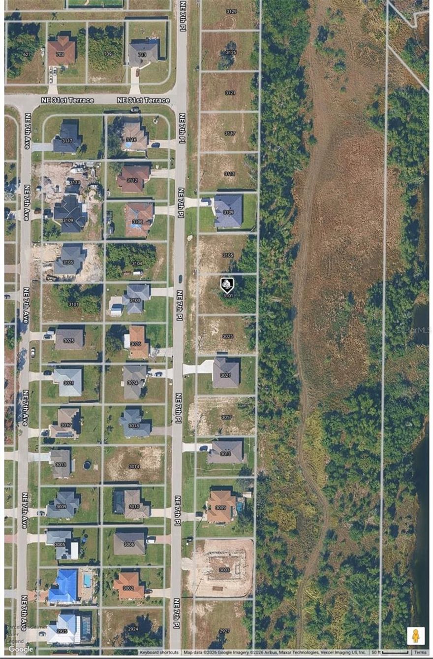 Take a look at the desirable Cape Coral area to build your dream home in. Beautiful new construction homes are already in the neighborhood just waiting for your family to begin building your new home. Not in a flood zone and electric is running along the road.  Not overlooked at the rear, enjoy your privacy! Close to beaches, boat ramps, shopping, and schools. BUY NOW to build now or invest for your future SWFL dream home.